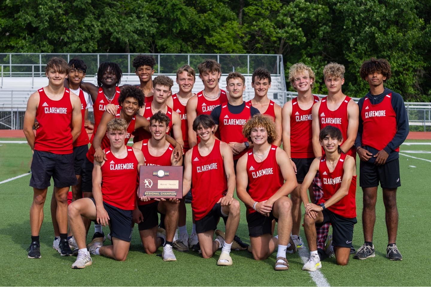 track team with regional champ trophy