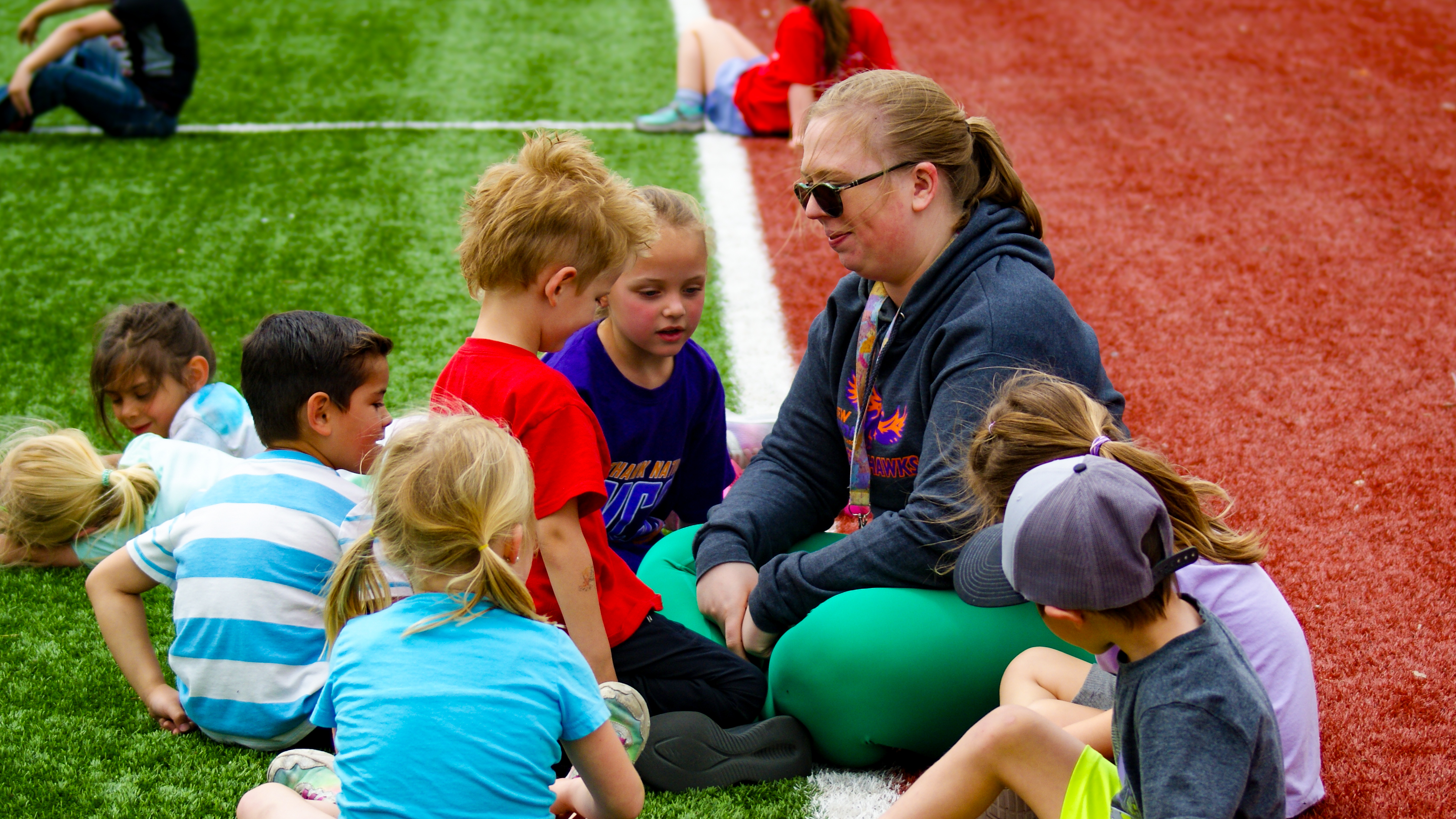 New Vision Charter School in Loveland - Photo of teacher and students at field day