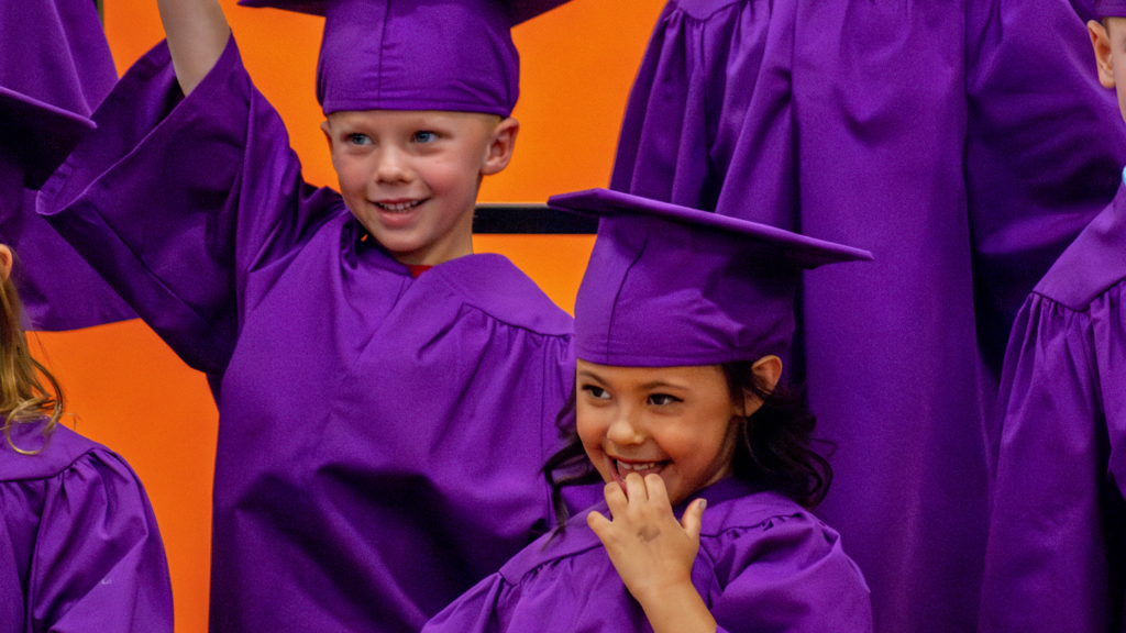 New Vision Charter School in Loveland - Photo of two students at Kindergarten Graduation