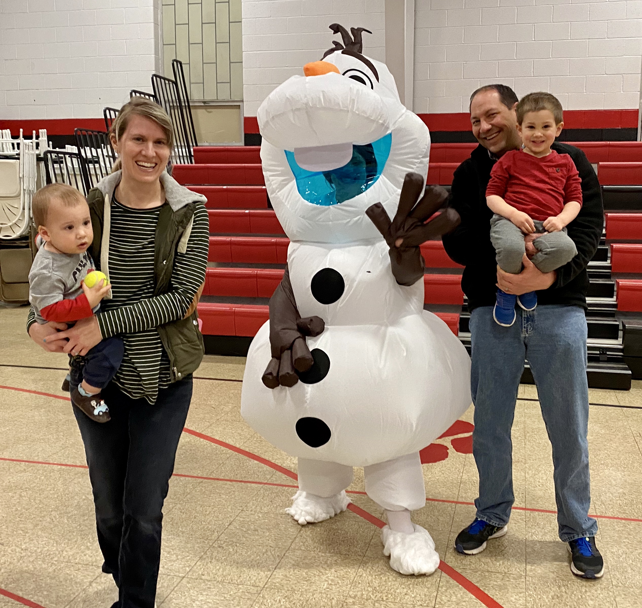 Adults and kids posting with Olaf