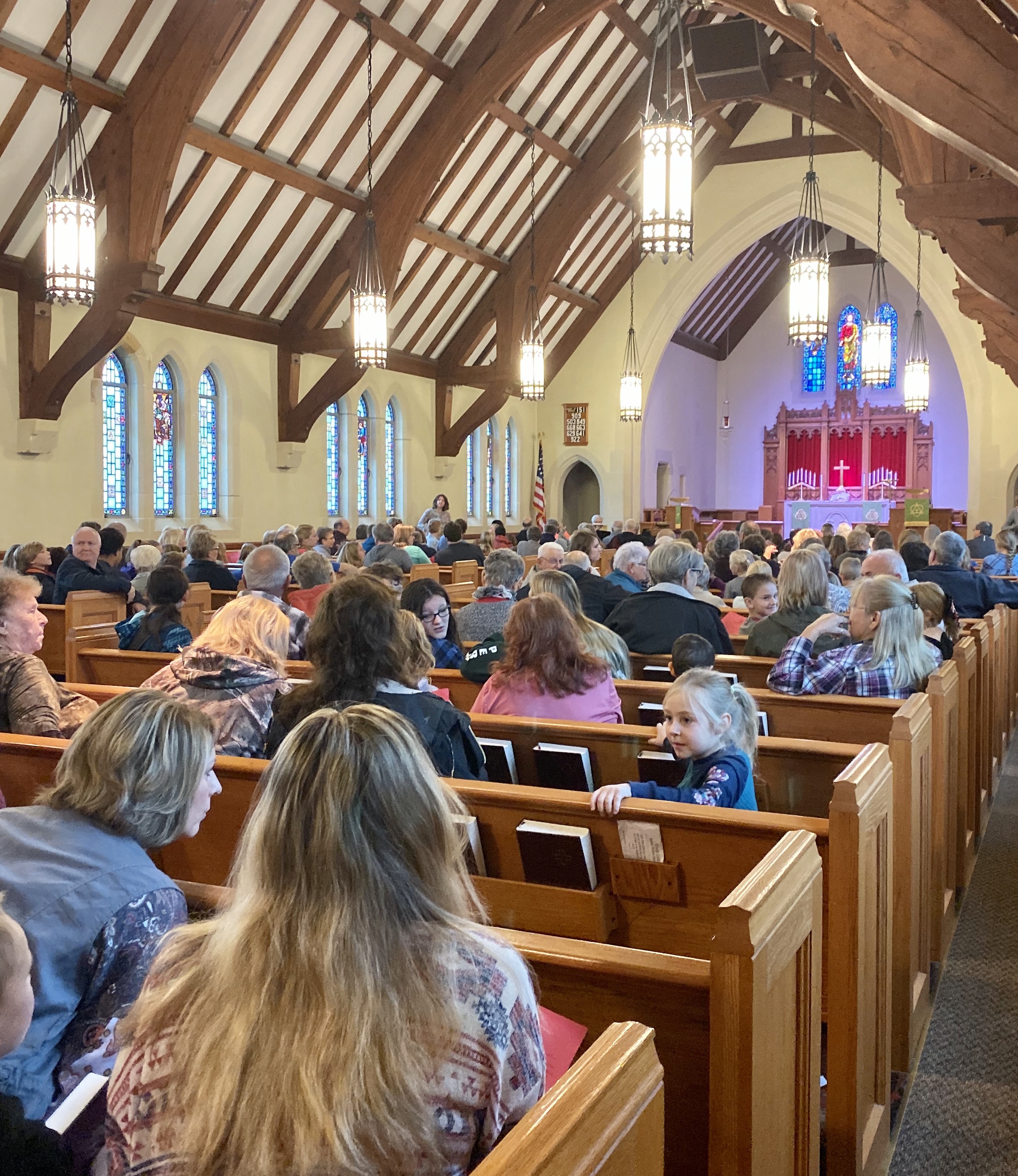 People sitting in church pews