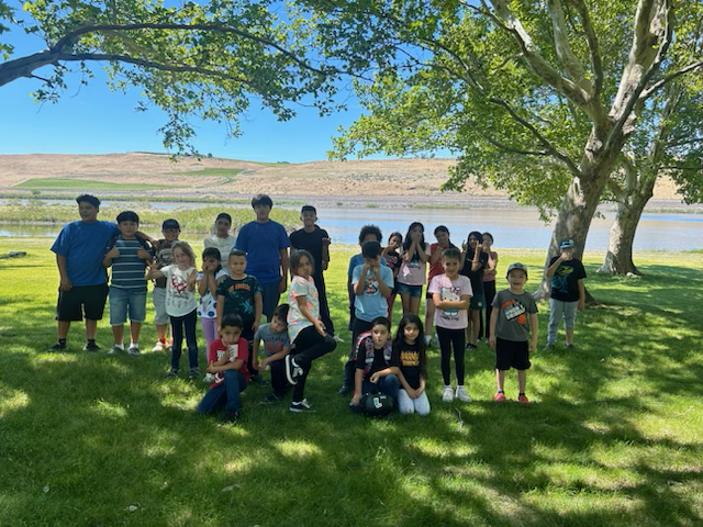 Group of students from the class of 2026 pose under a tree outdoors