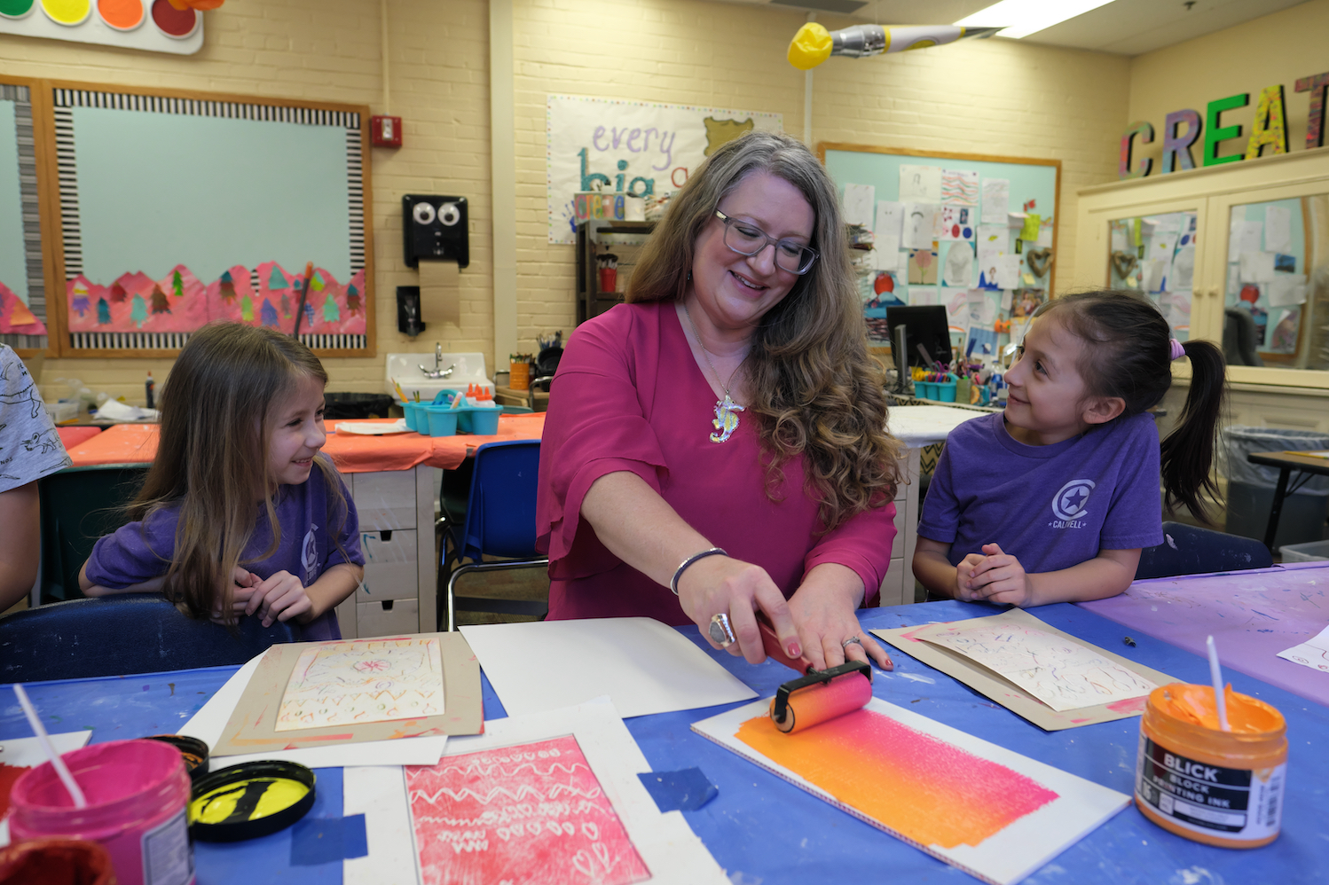 teacher working with paint