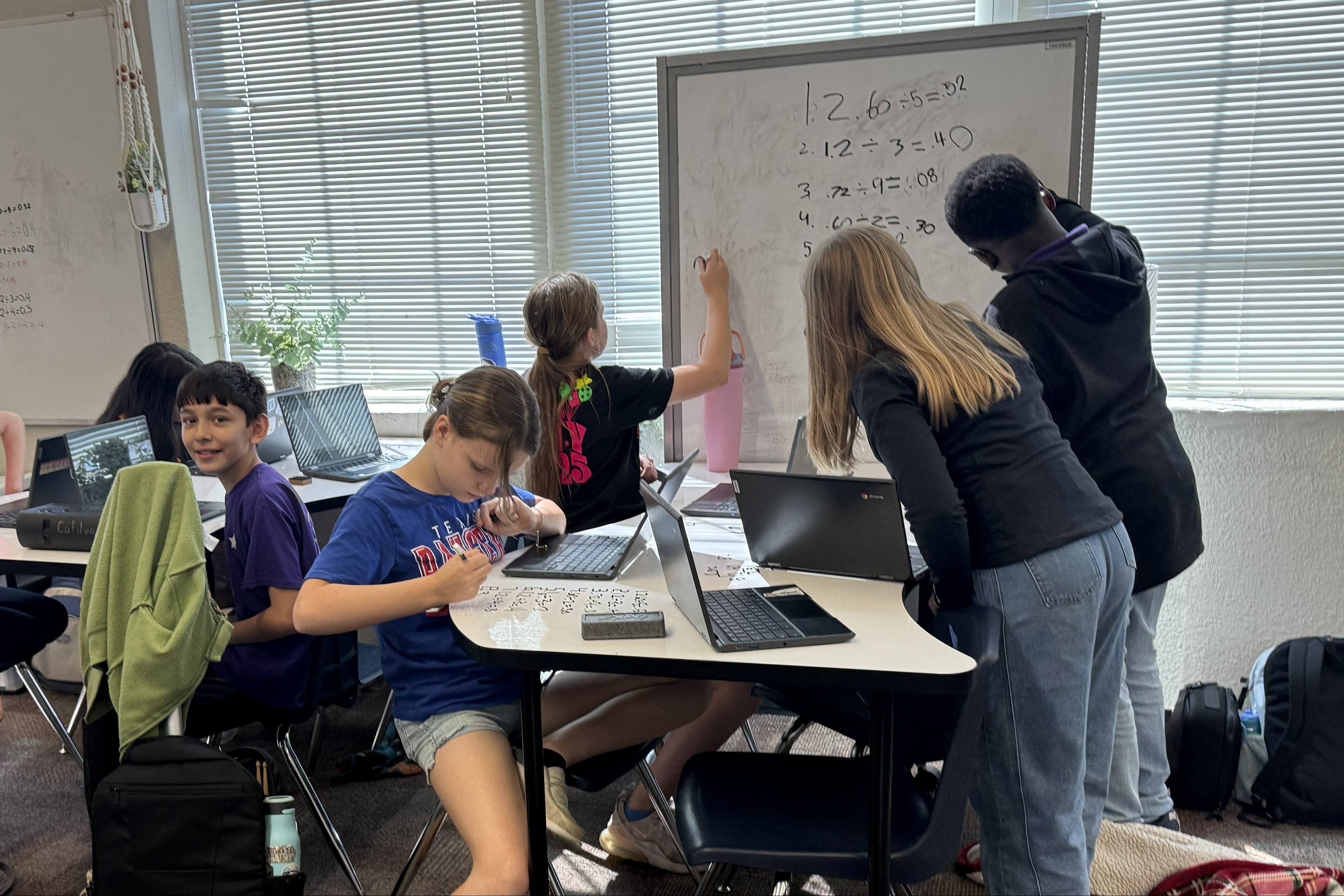 male and female students working for solutions