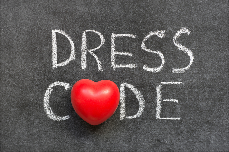 Dress Code written in chalk on ground with heart shaped O in word code
