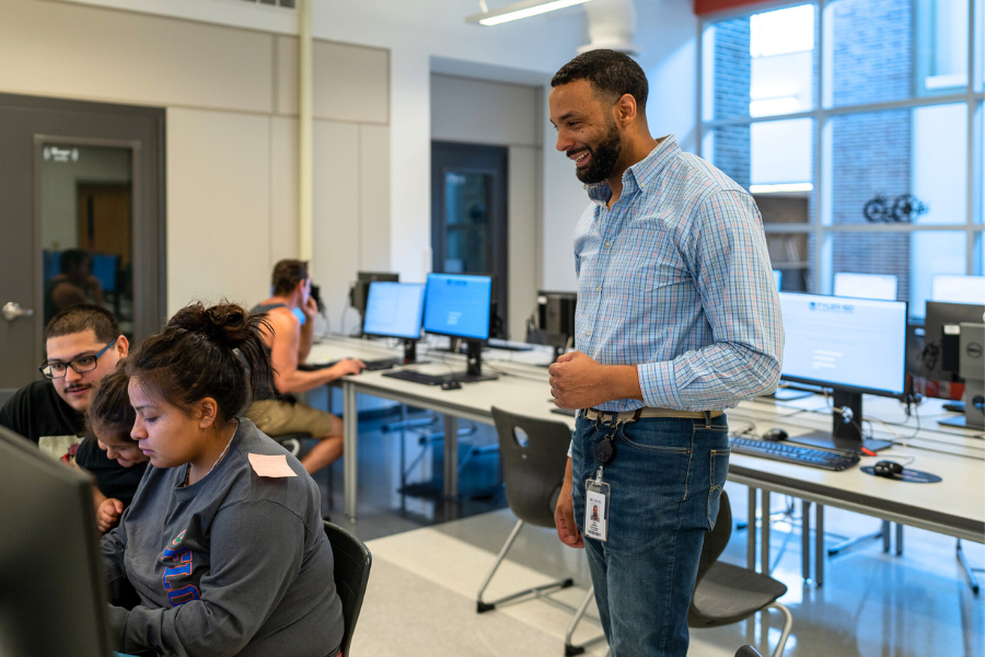 parents enrolling students on computers