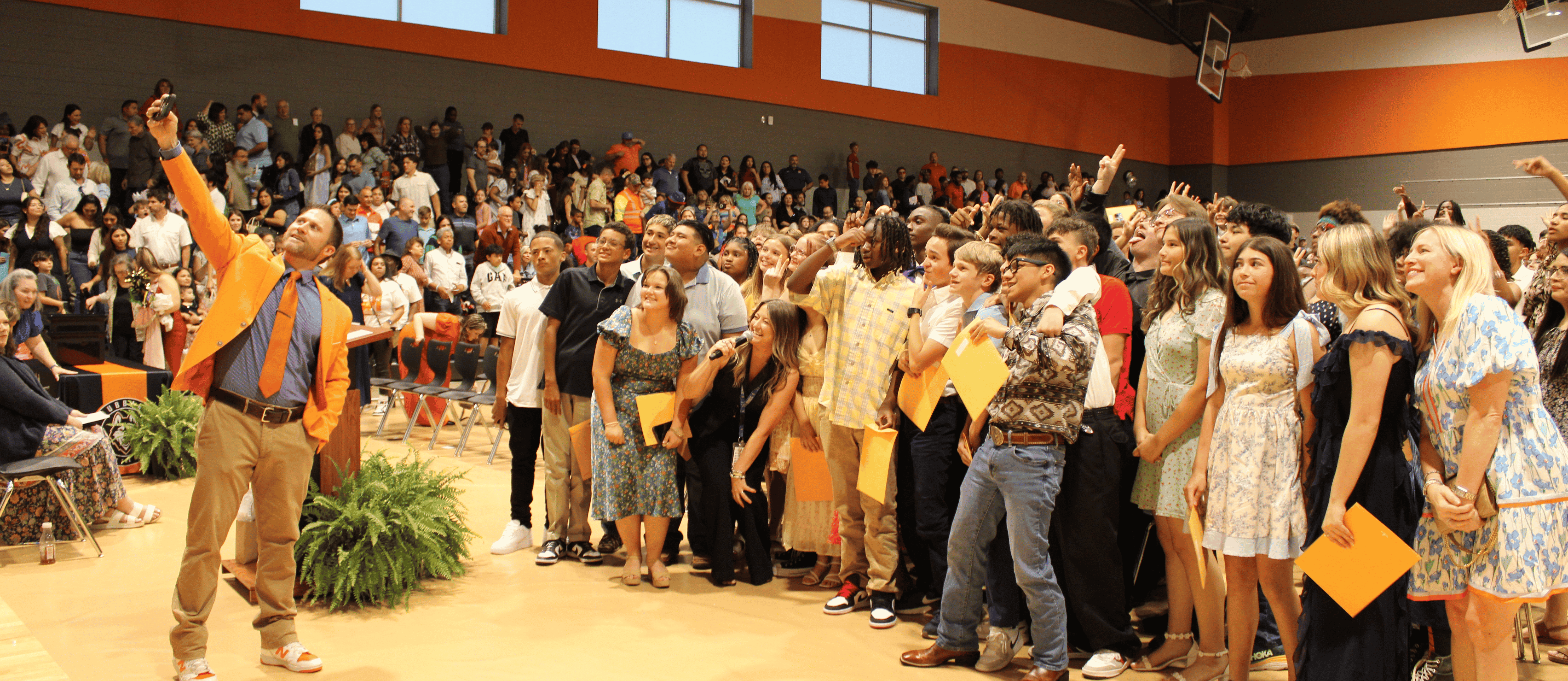 principal taking a selfie with a large group of students