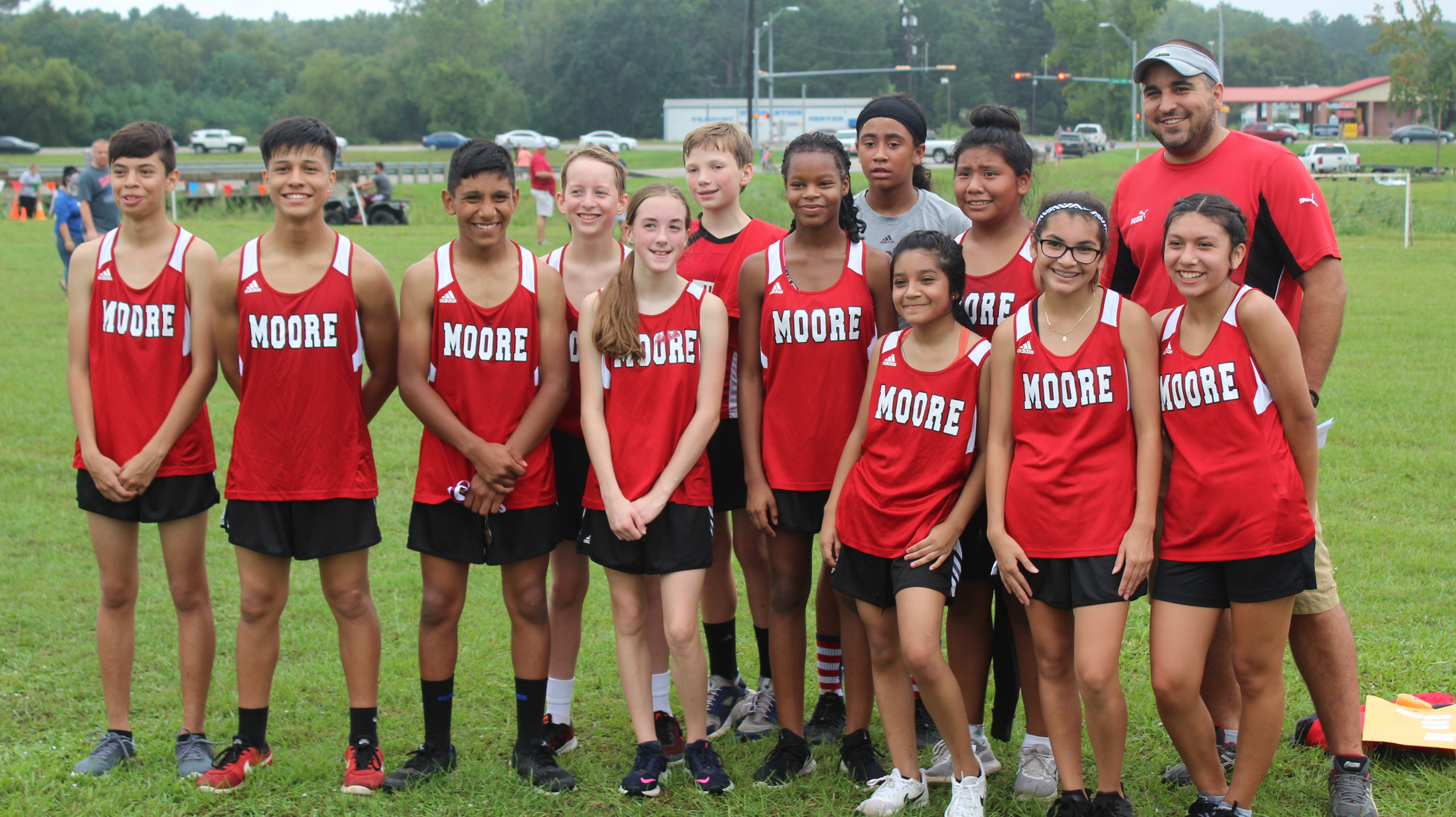 Moore cross country players posing