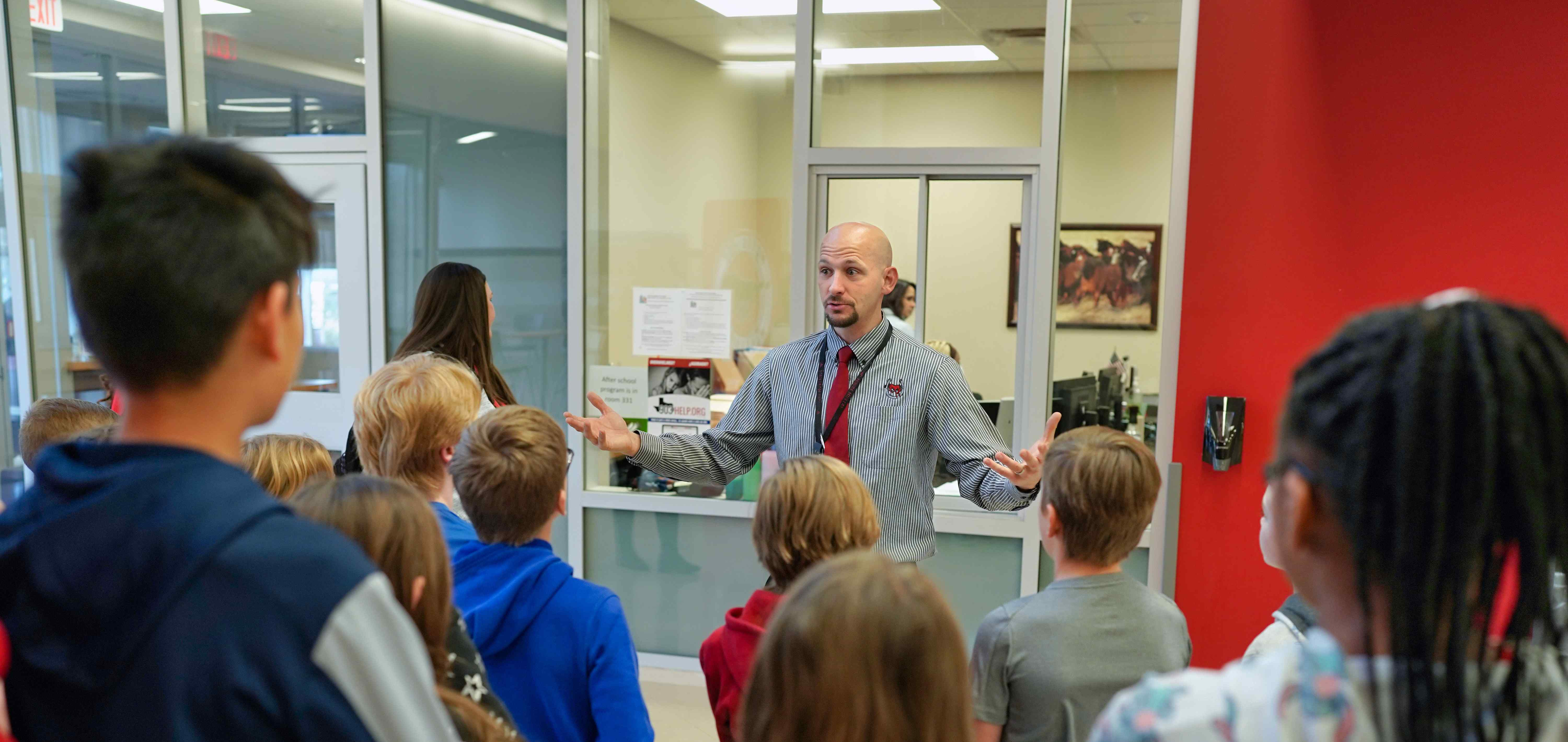 principal speaking to students