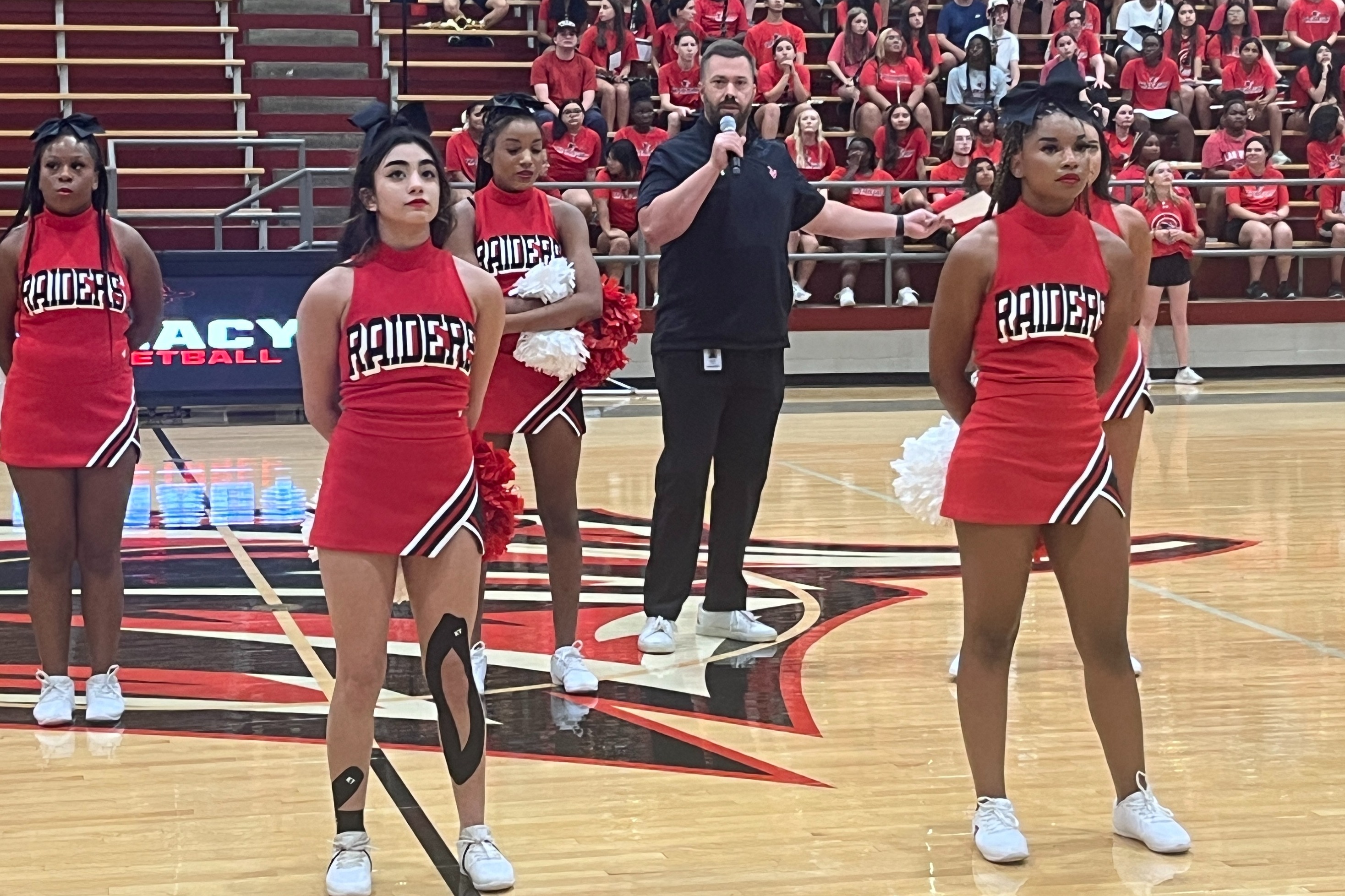 Mr. Sherman and Tyler Legacy cheerleaders at Fish Camp