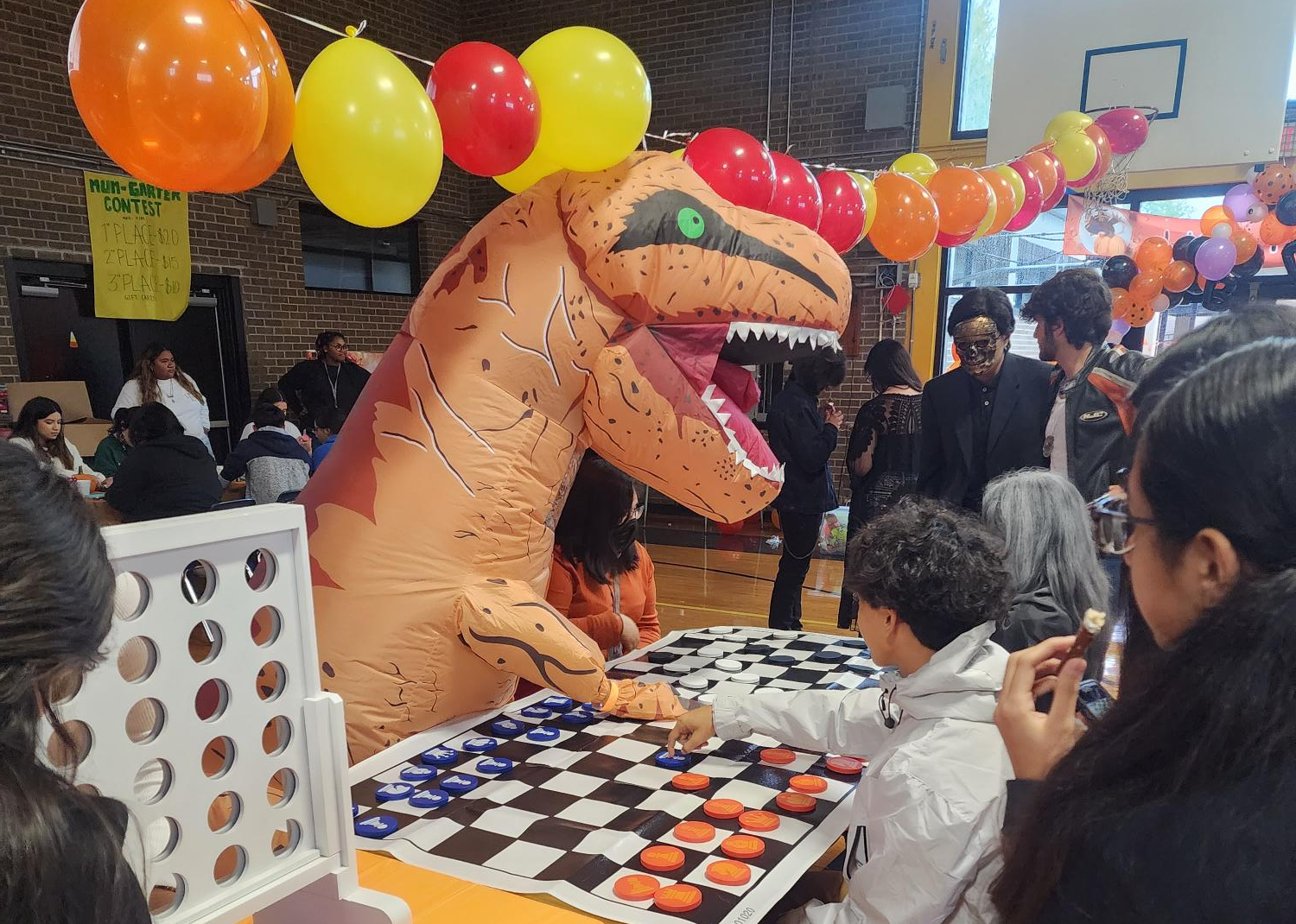 event with student in t rex outfit