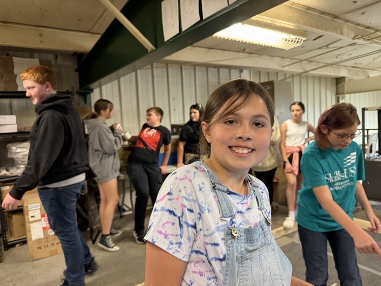 Student smiling at 5th grade transition event