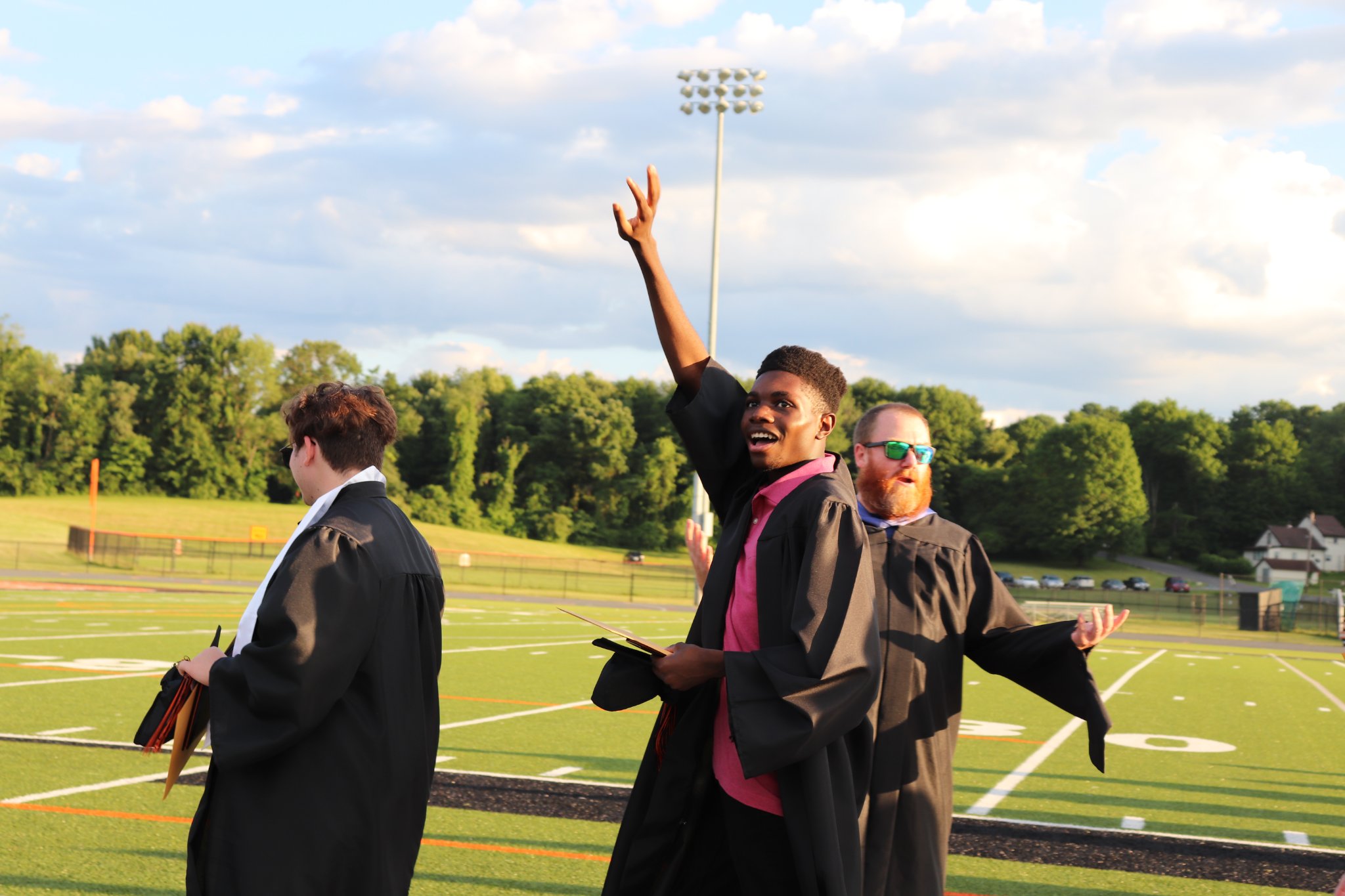A waving graduate