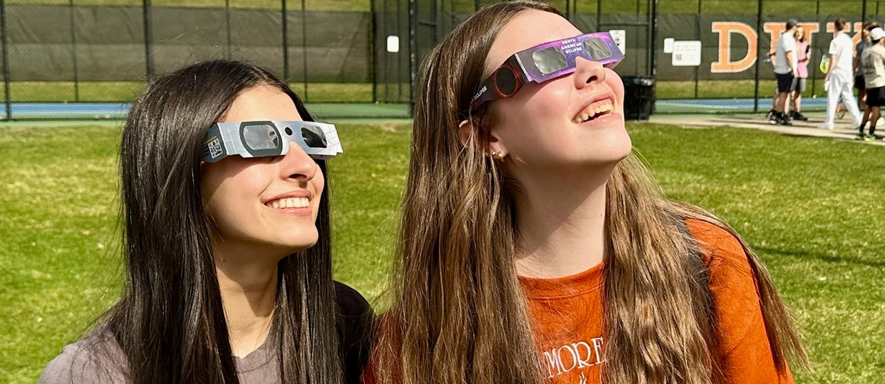 Two high school students viewing the eclipse