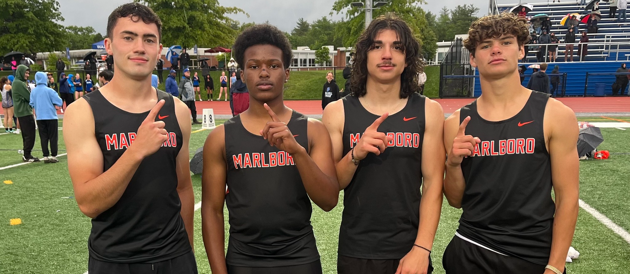 Track students posing for a photo