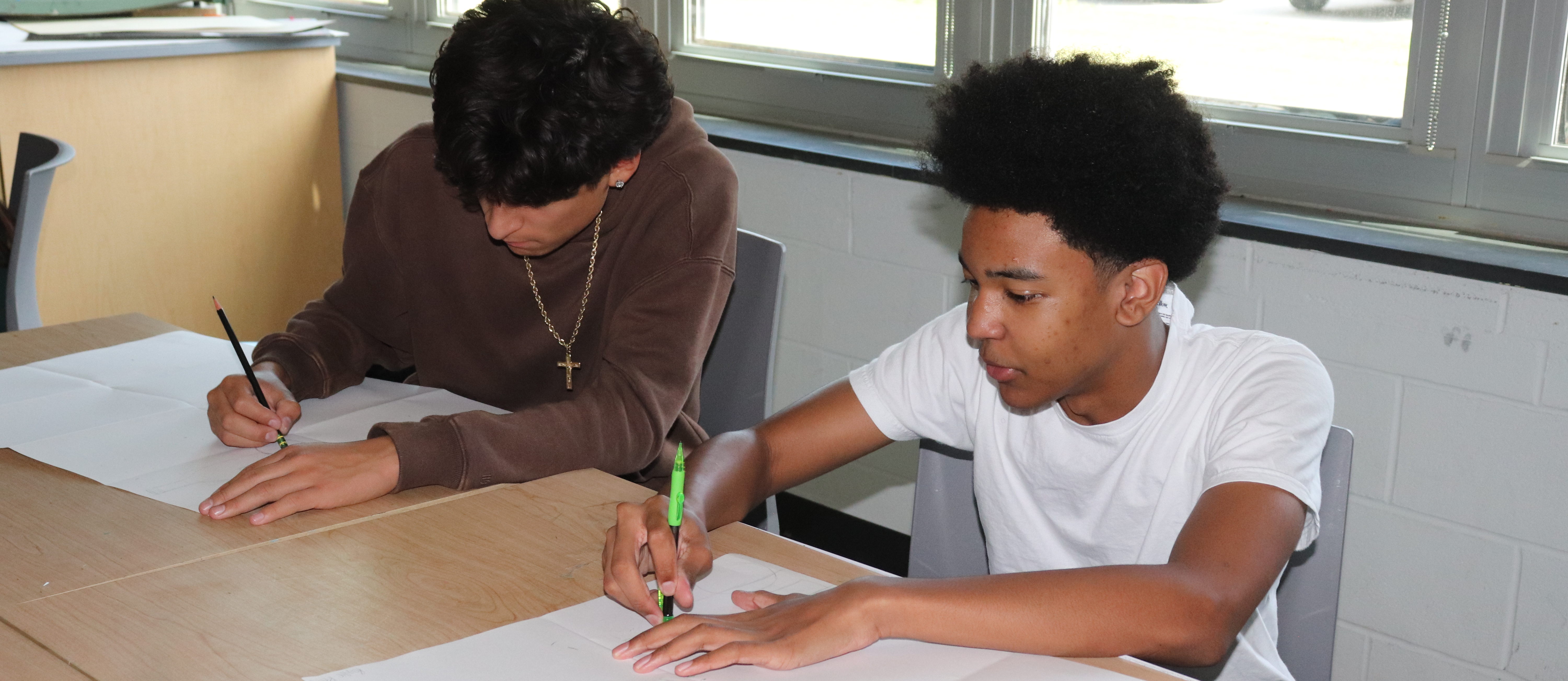 Two students drawing