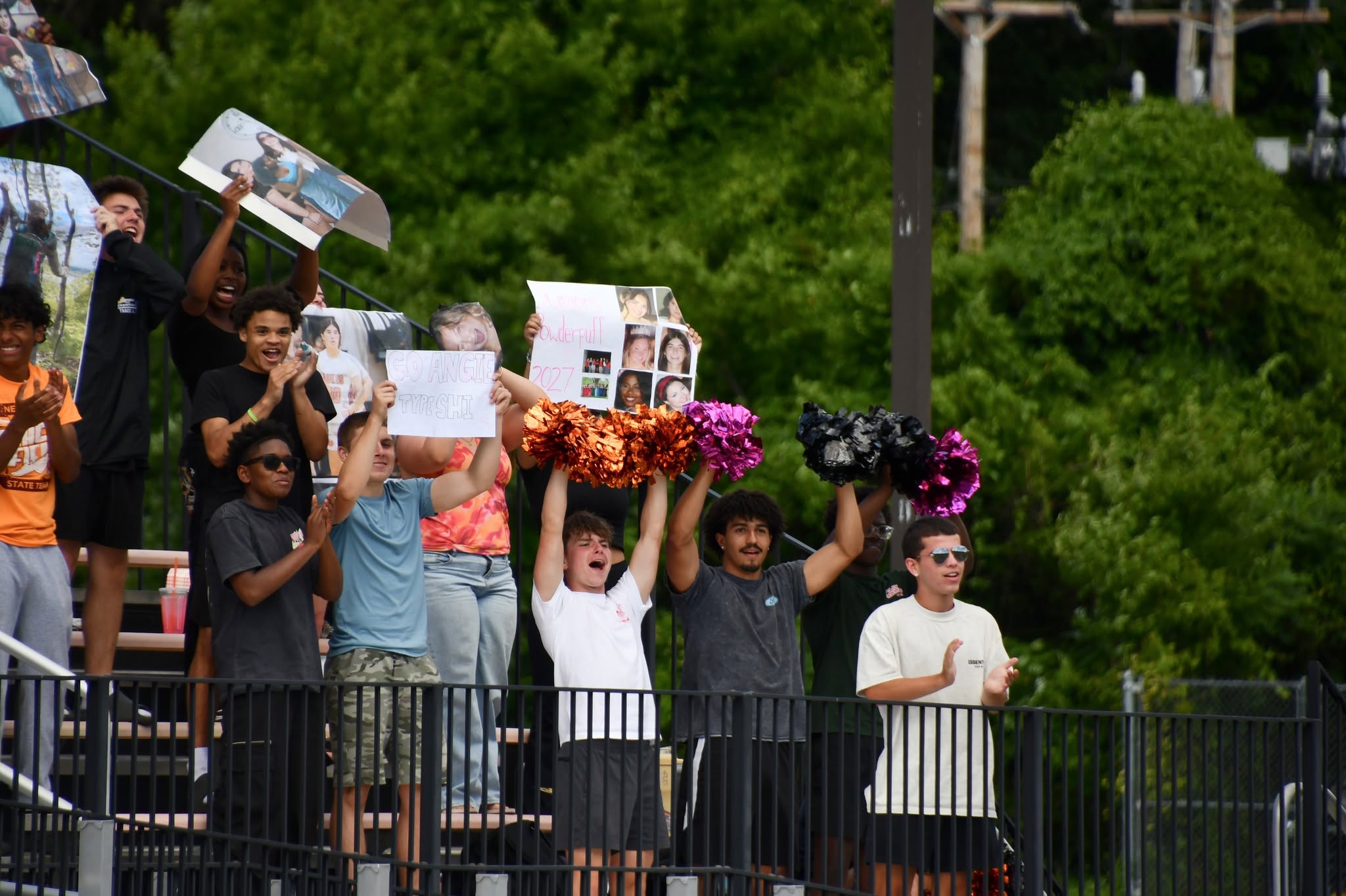 boys cheering on powderpuff team
