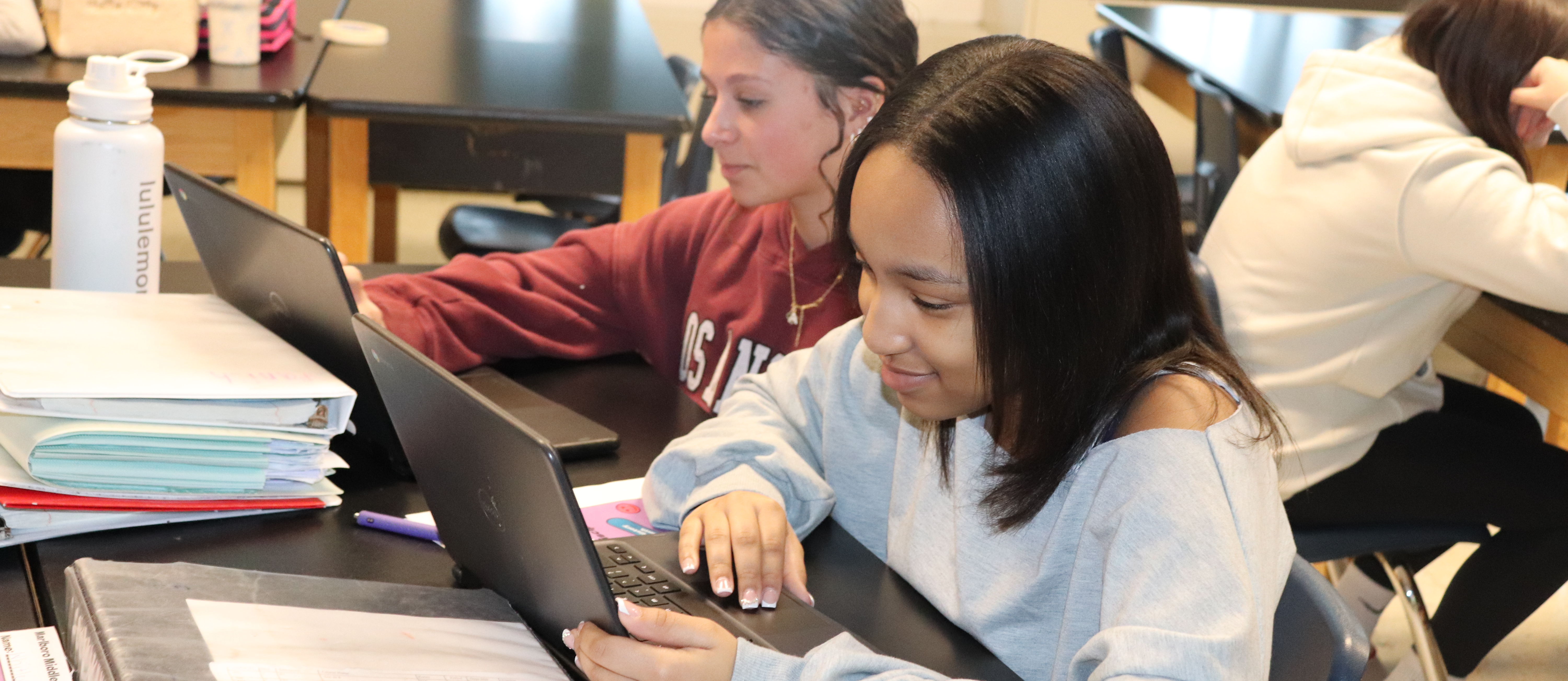 Two students working at computers