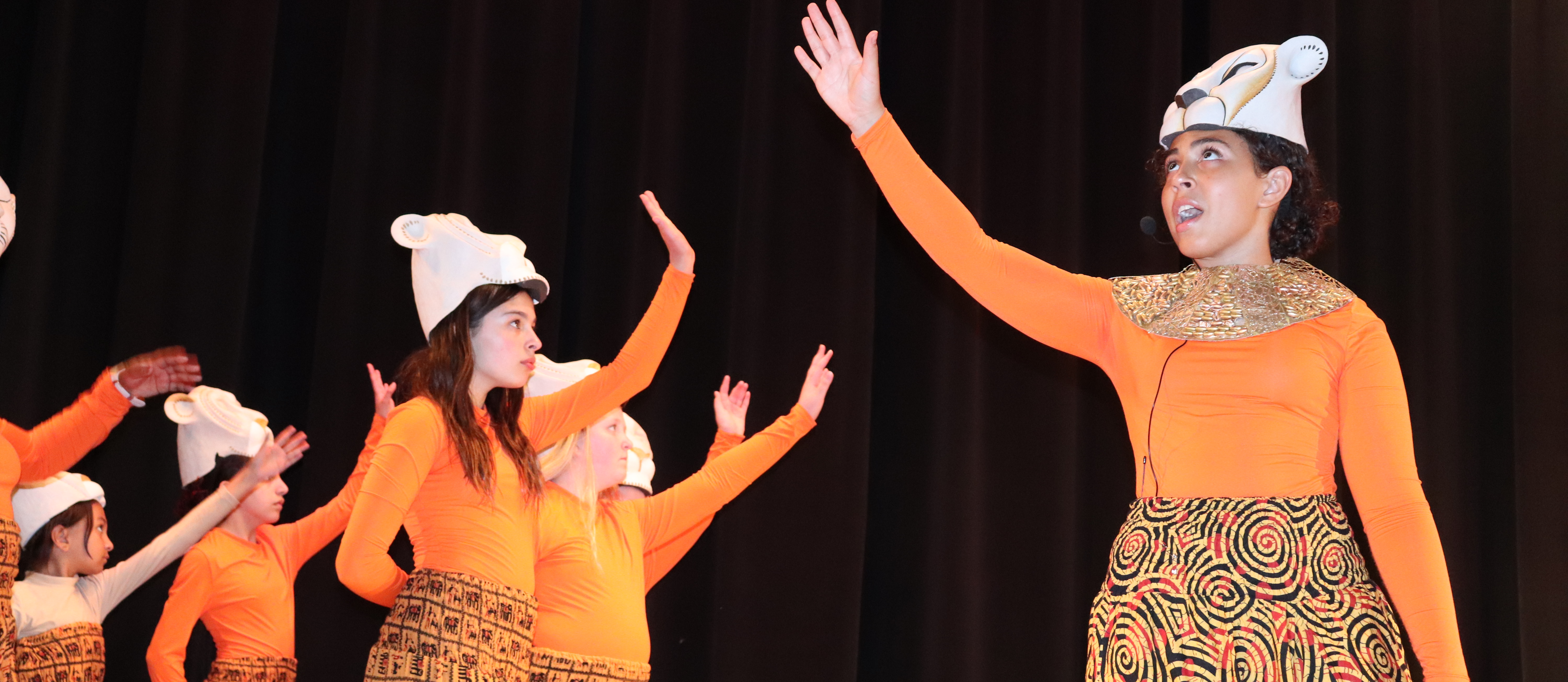 Student actors on stage