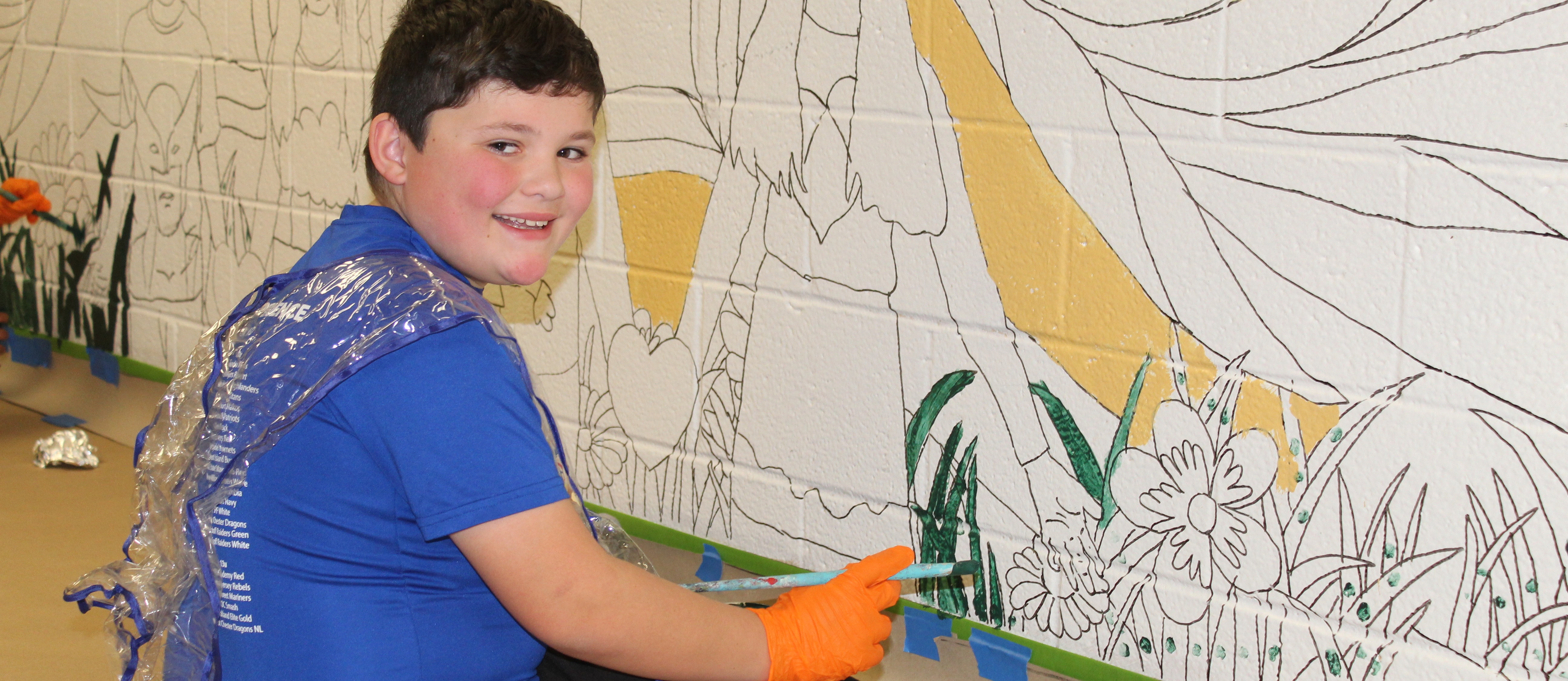 Grade 5 student paints a mural