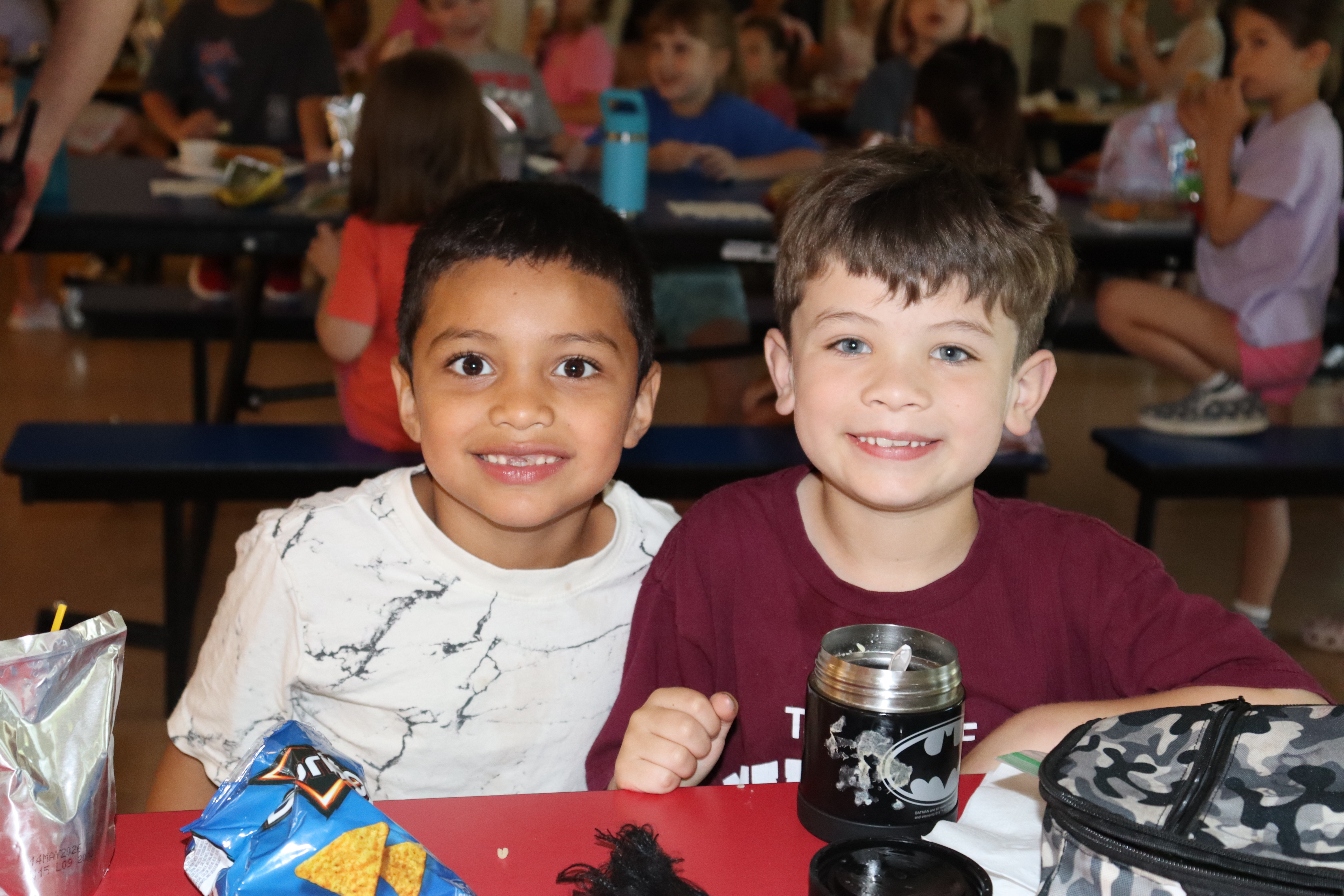 Two students at a lunch table