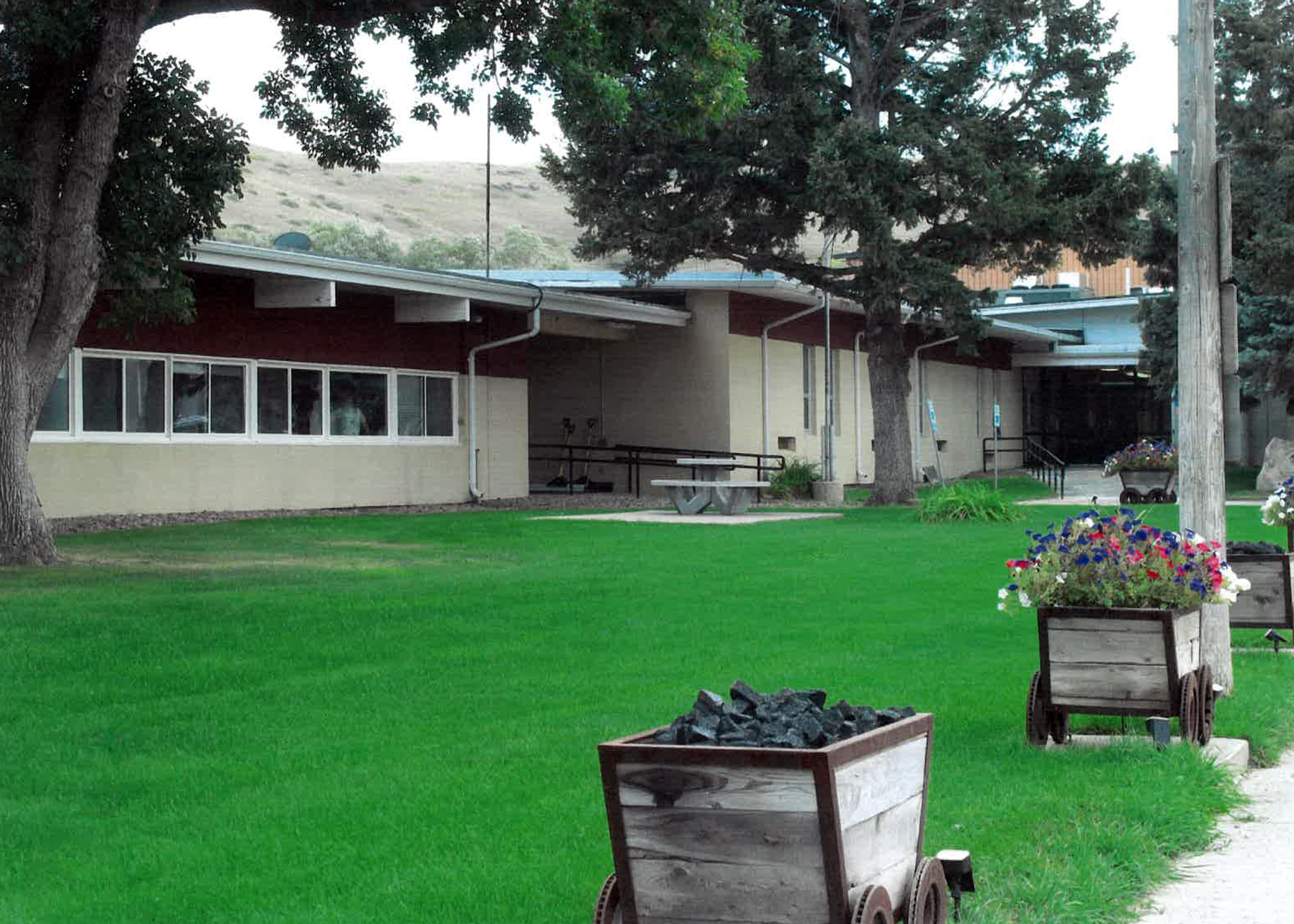 front of the Centerville school building, coal cart in foreground
