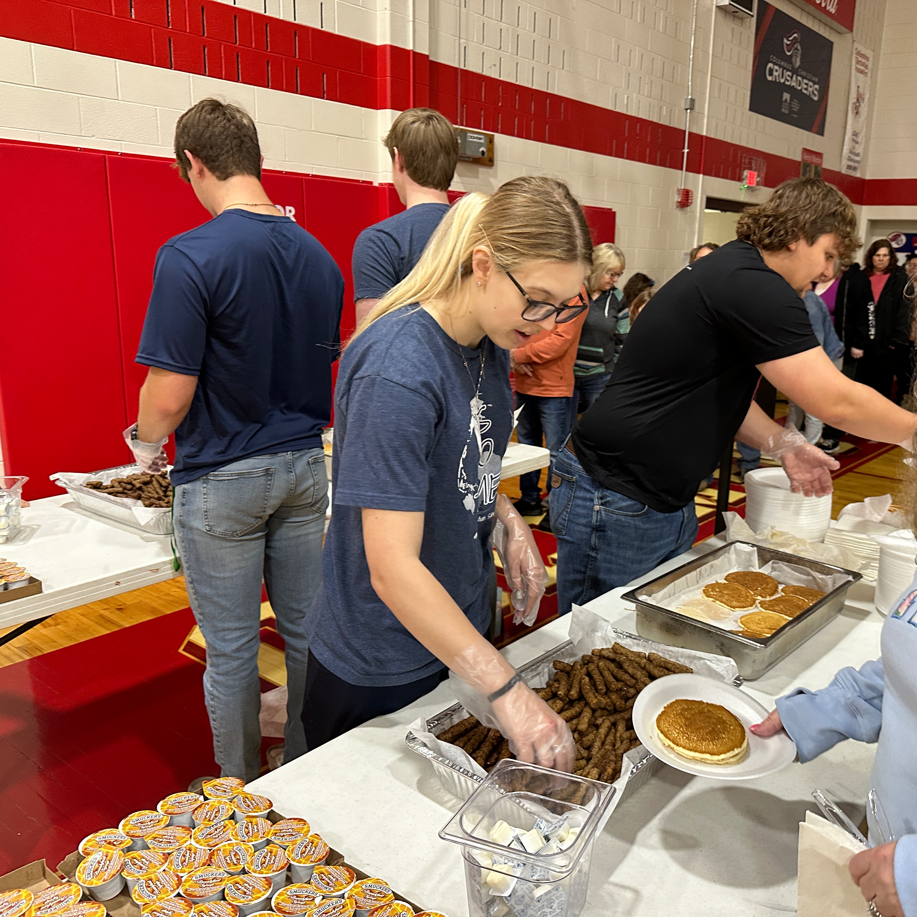 Seniors serving breakfast