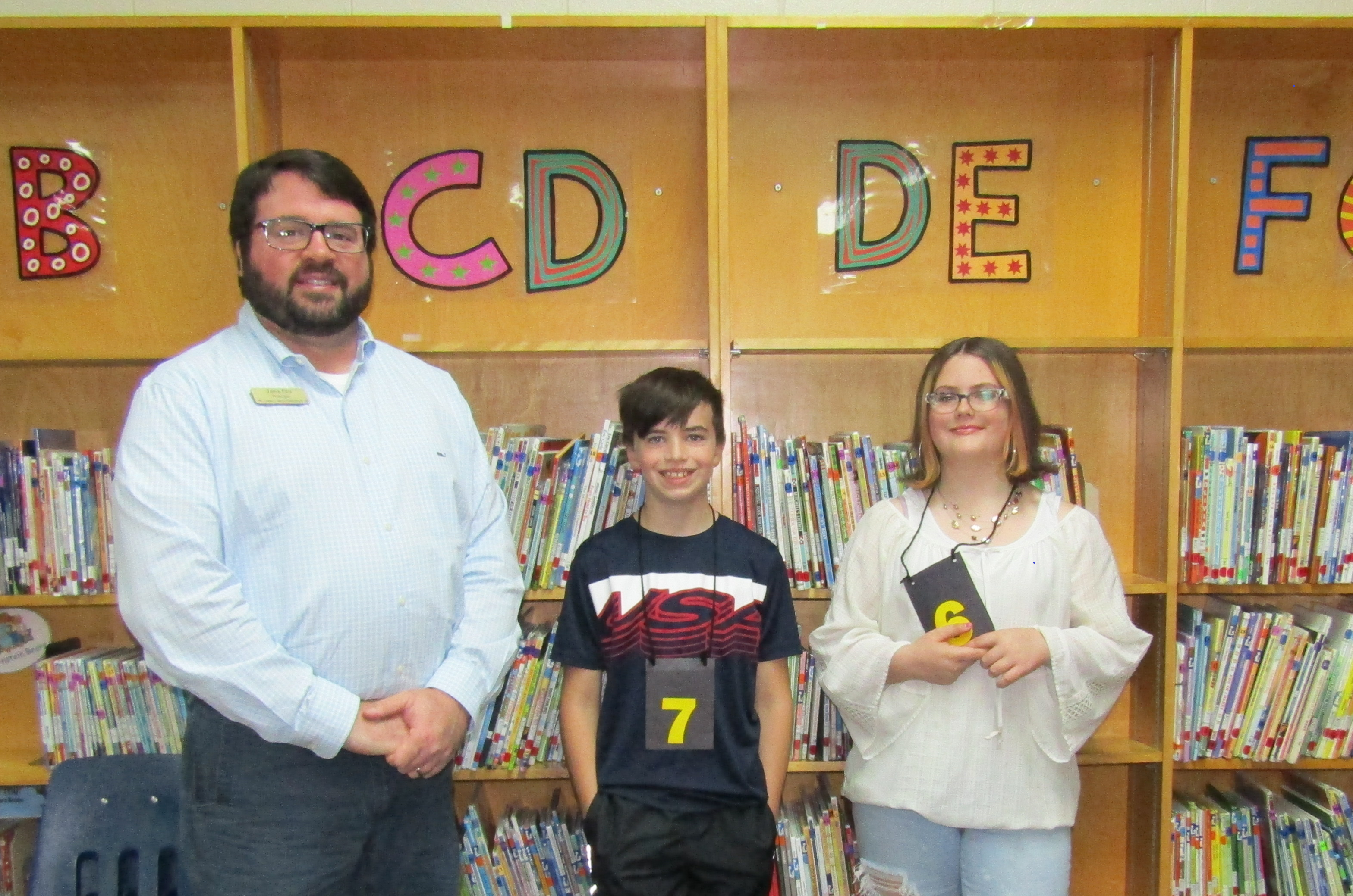 Mr. Ellis, Gavin Duke, Spelling Bee Runner Up, and Rylee Wells, Spelling Bee Winner