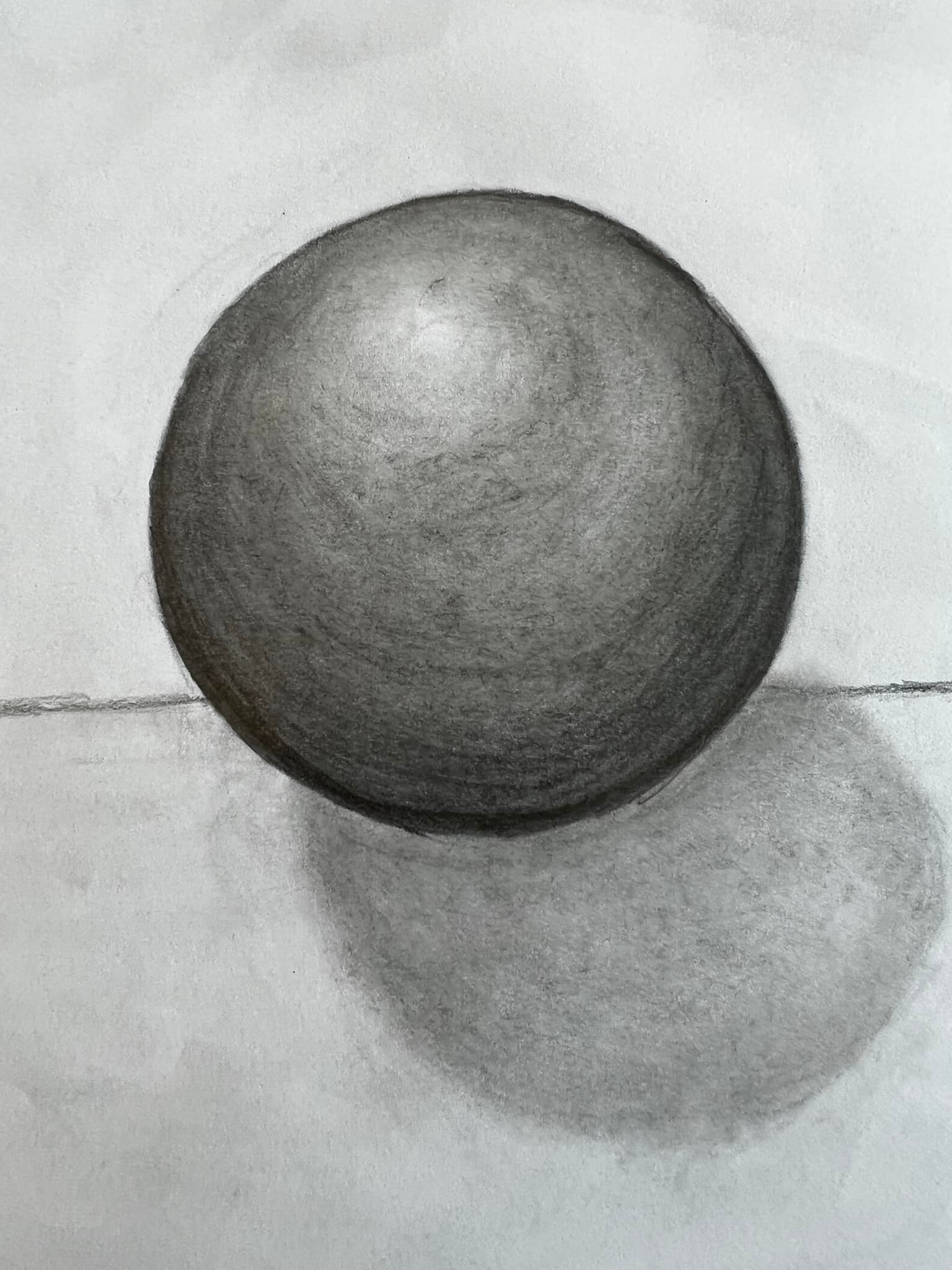 Pencil drawing of sphere with shadow