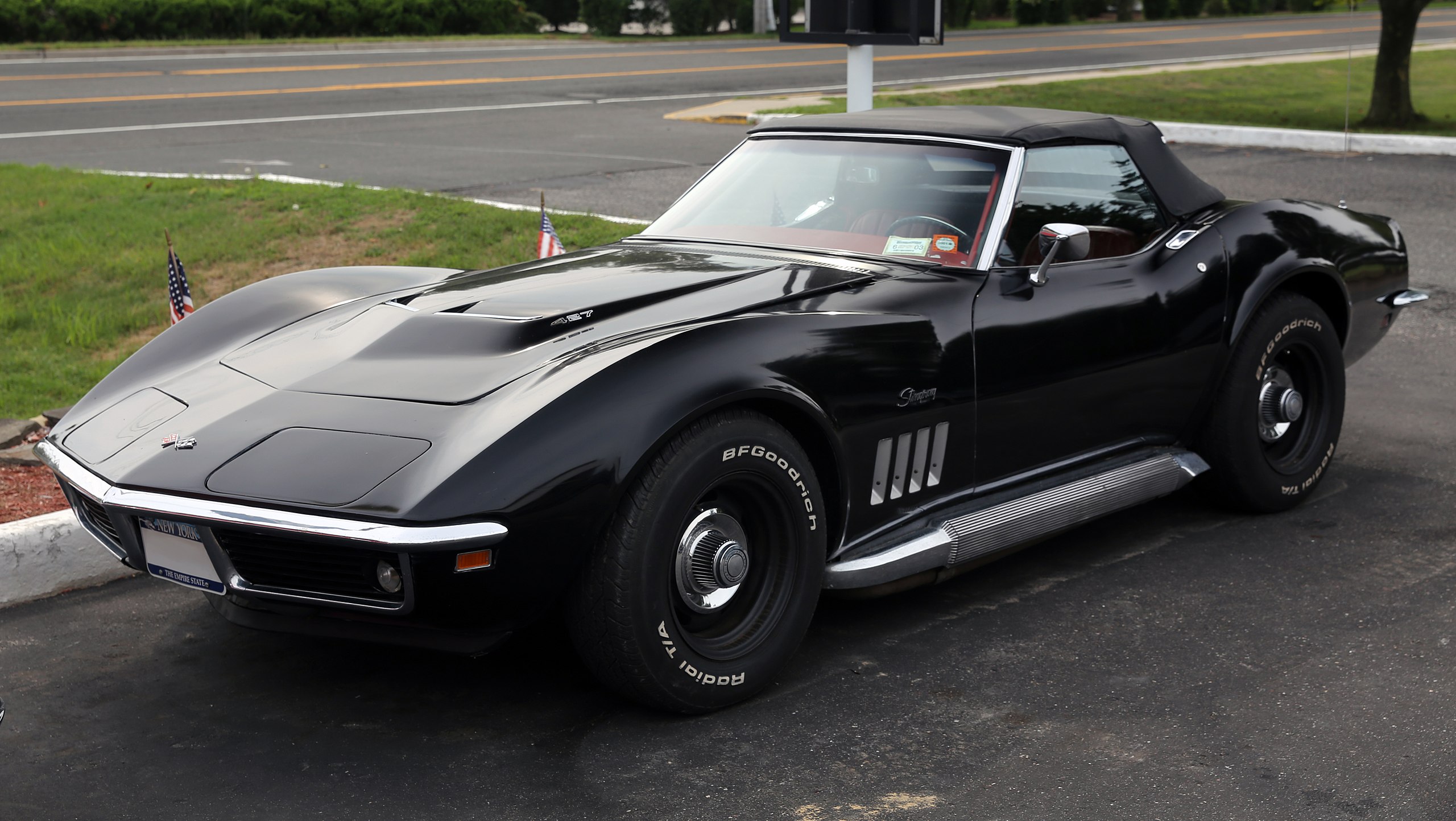 1969 Chevy Corvette Stingray Convertible all black with street in background