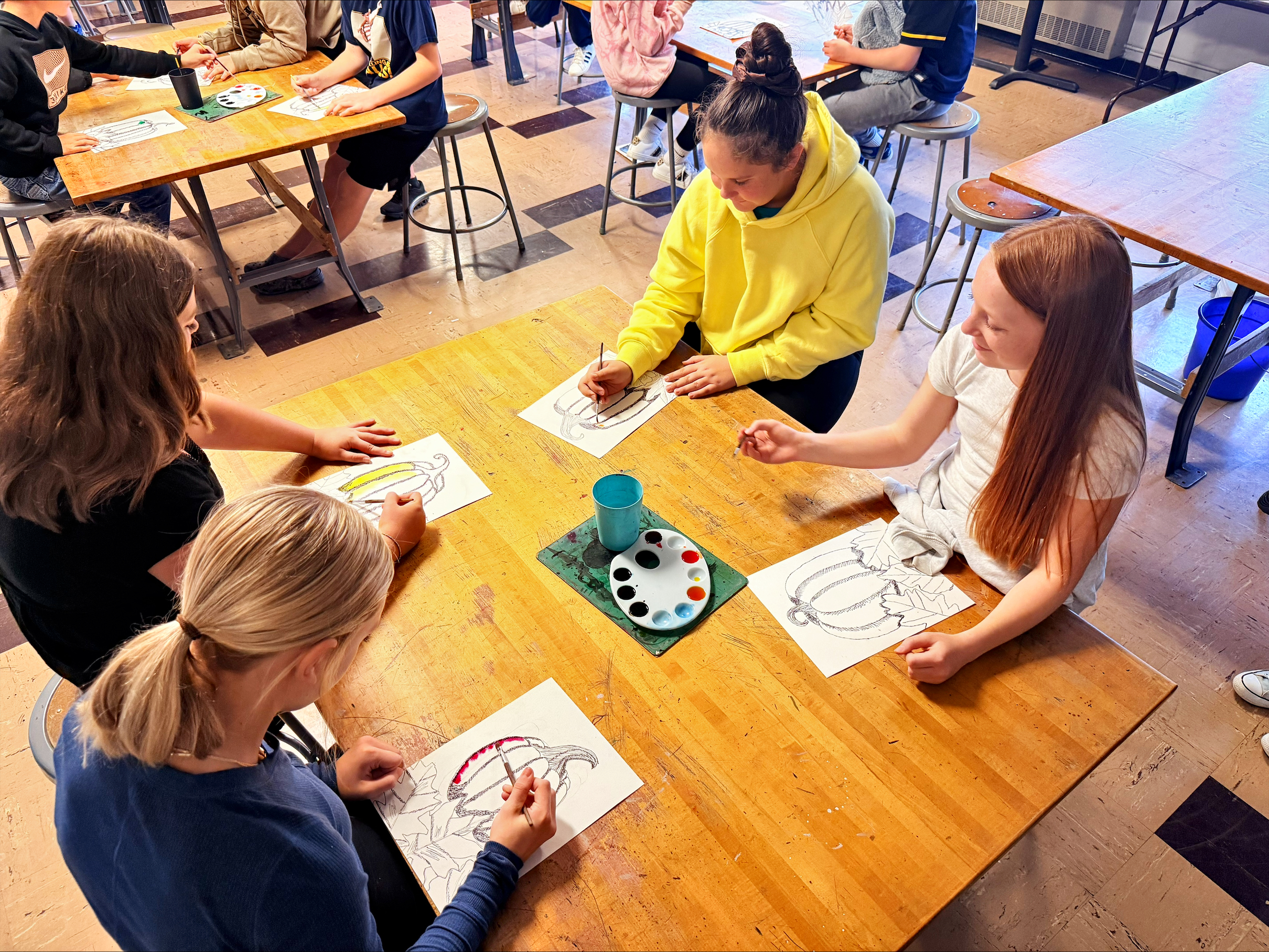 BUMS Students Learning about art while completing art pumpkins
