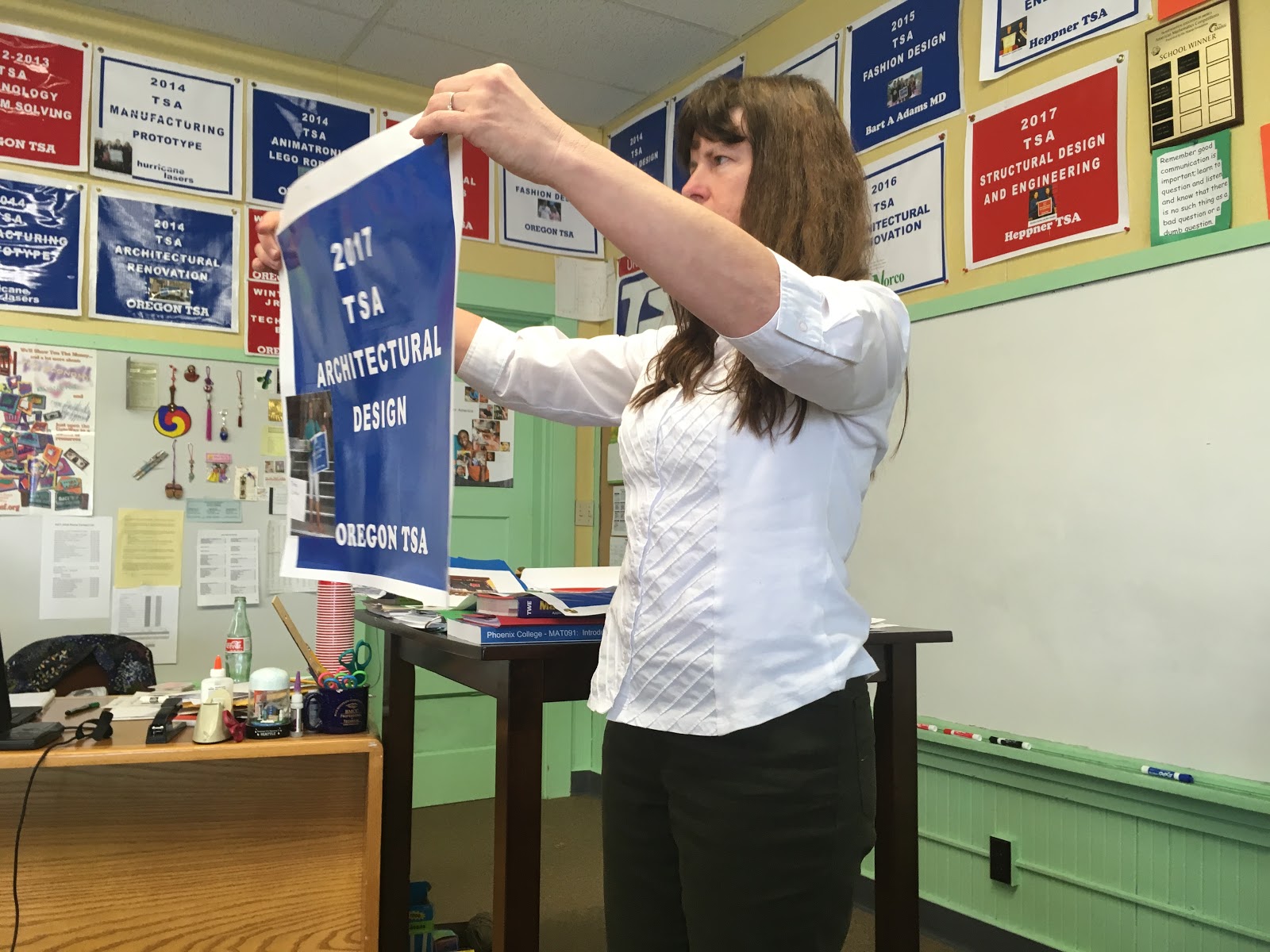 Ms. Veach with winning banner for TSA Club