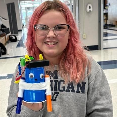 student with marker bot