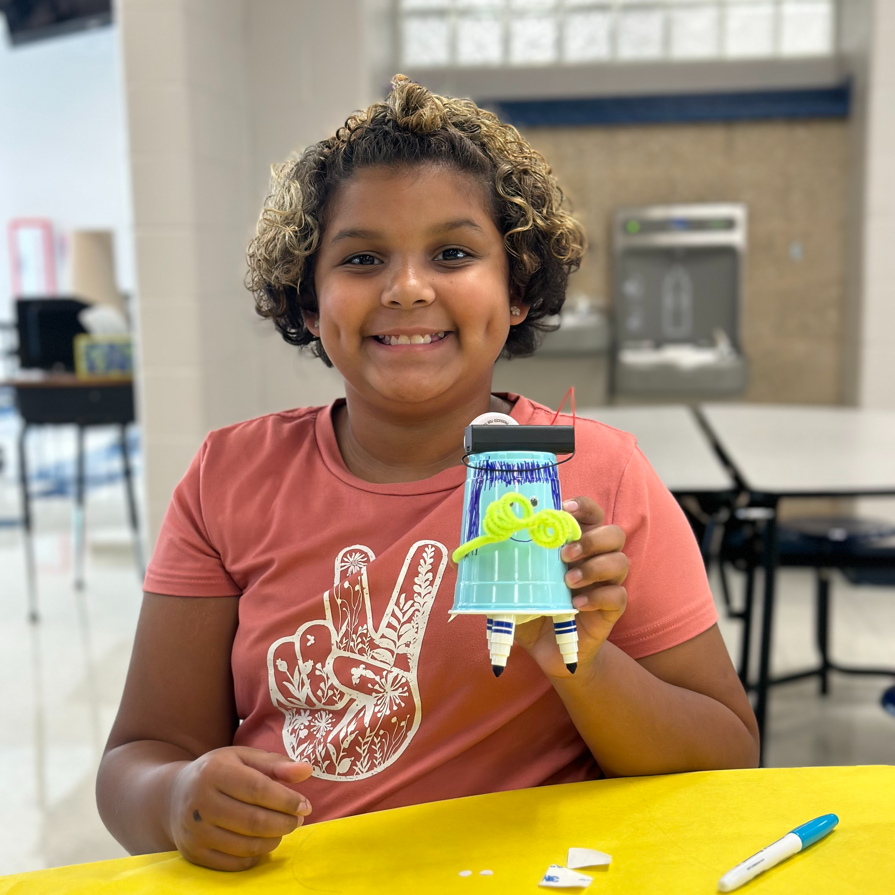 student with marker bot