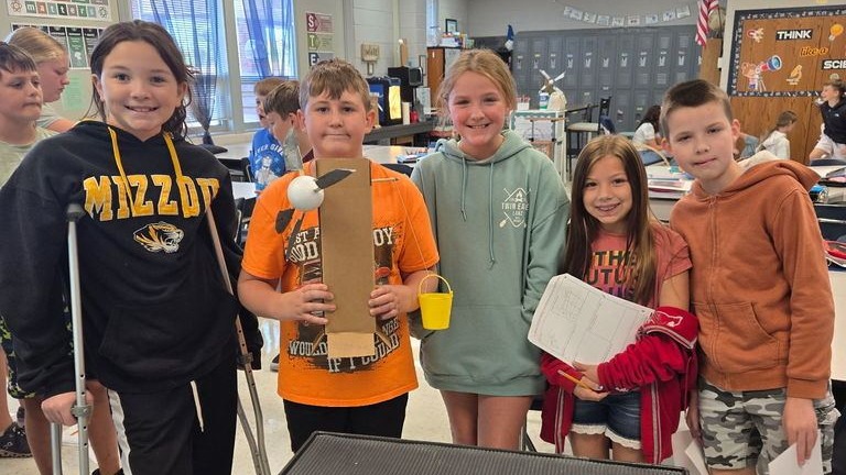 student with marker bot