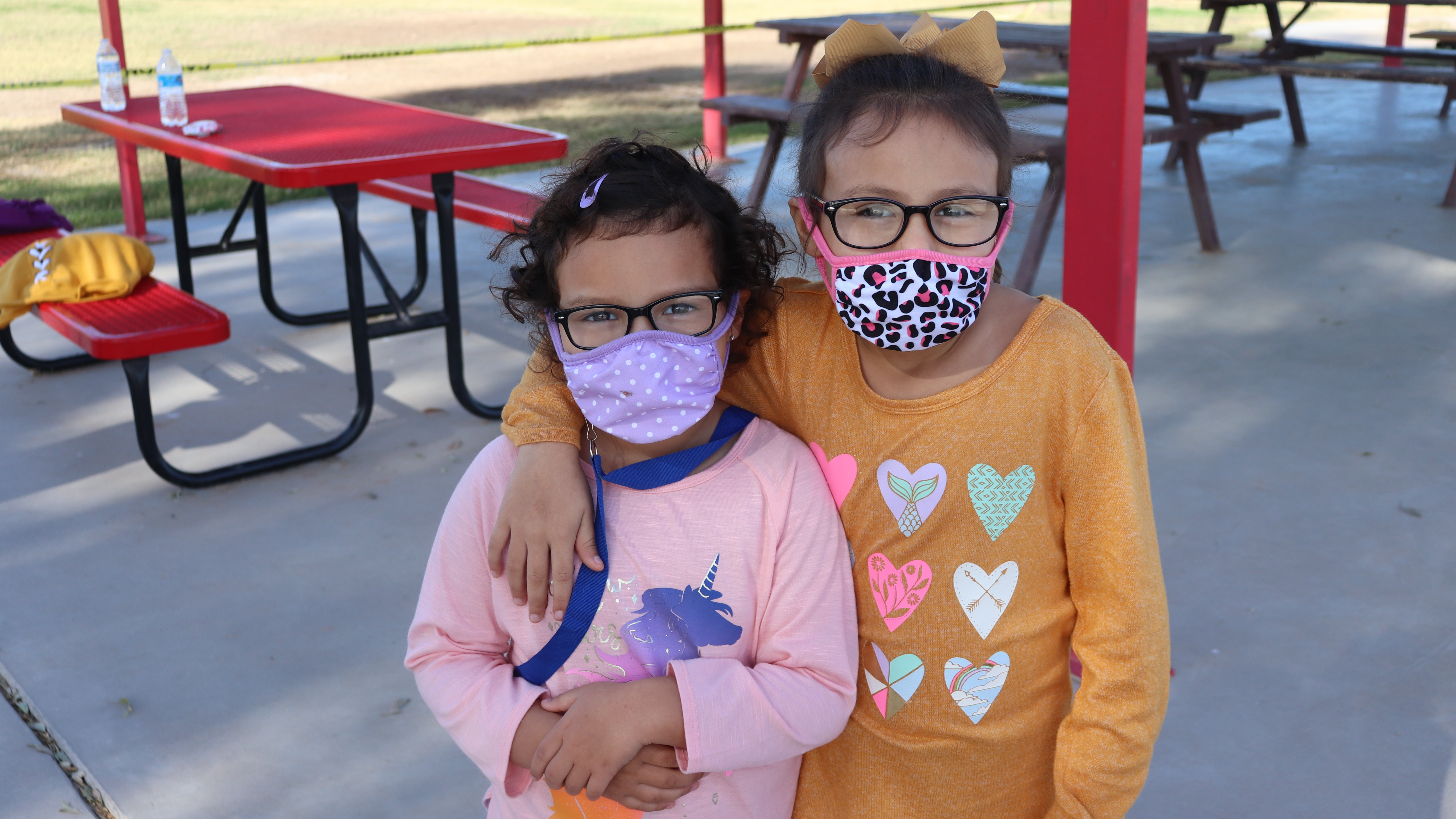 "Little Rebels" in masks on the playground.