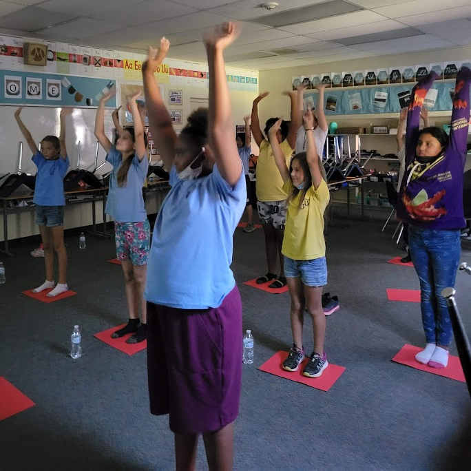 Doing Yoga stretch's during club 