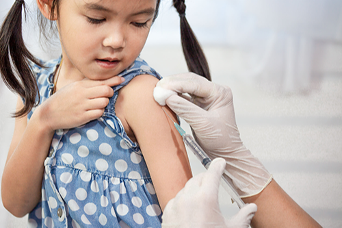 young child getting an immunization shot