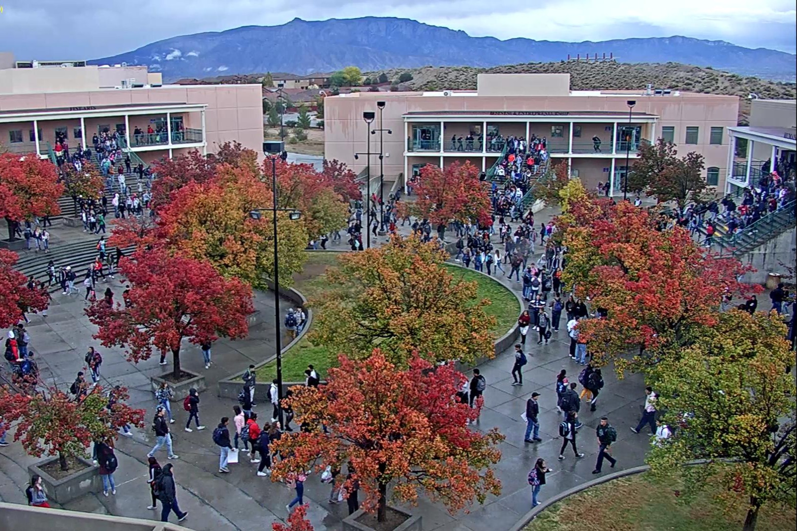 Rio Rancho High School courtyard in fall with red and gold trees
