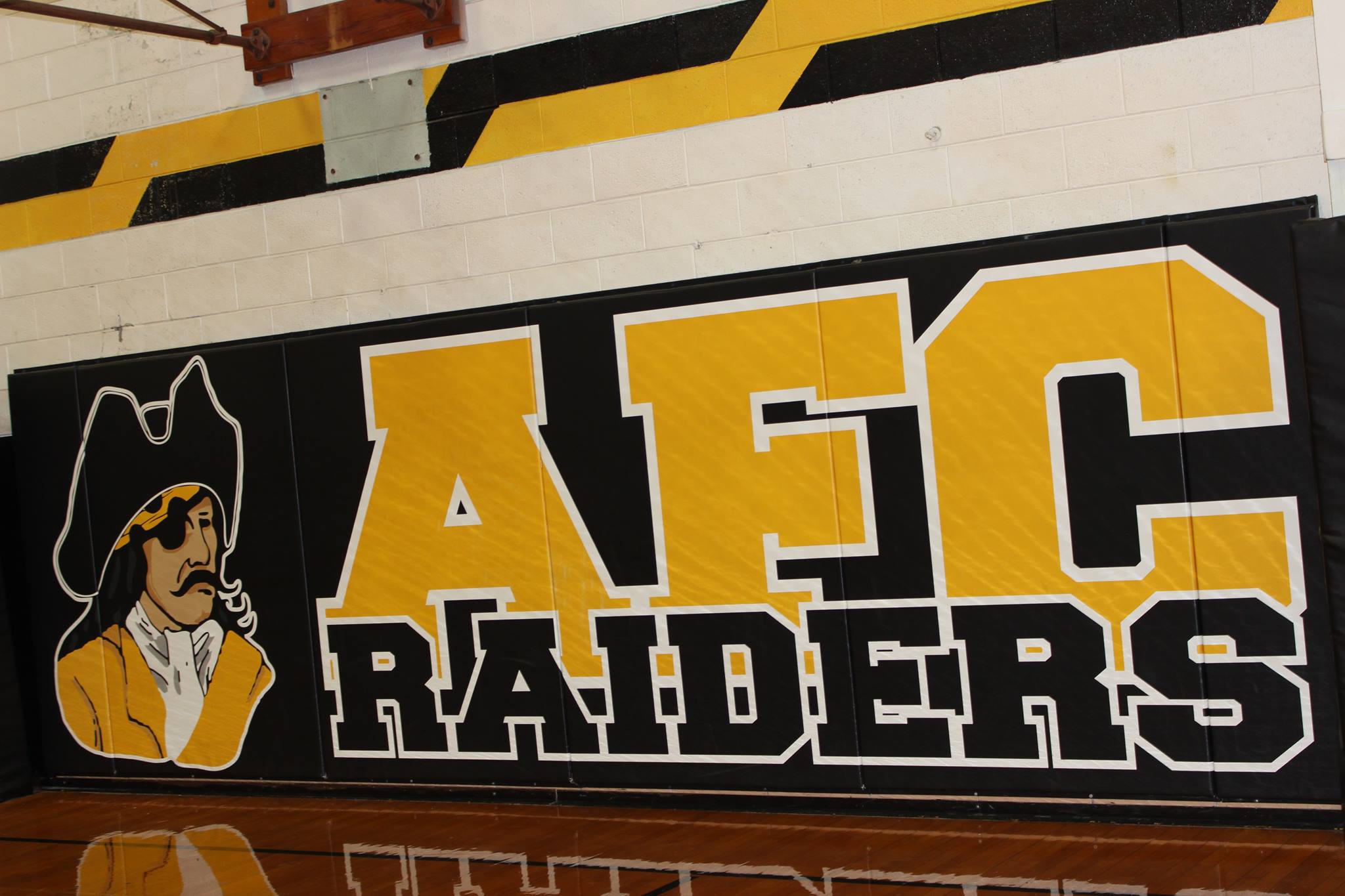 AFC Raiders sign in gymnasium