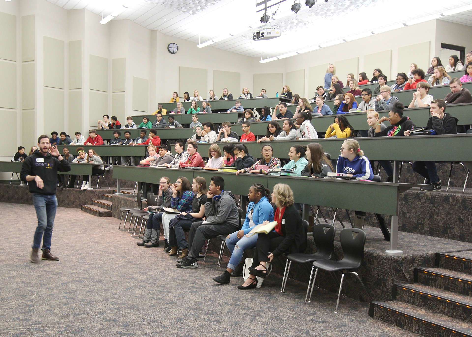 Students listening to a speaker