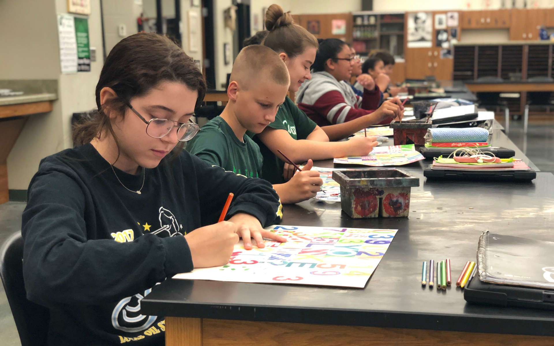 Students working on art assignments