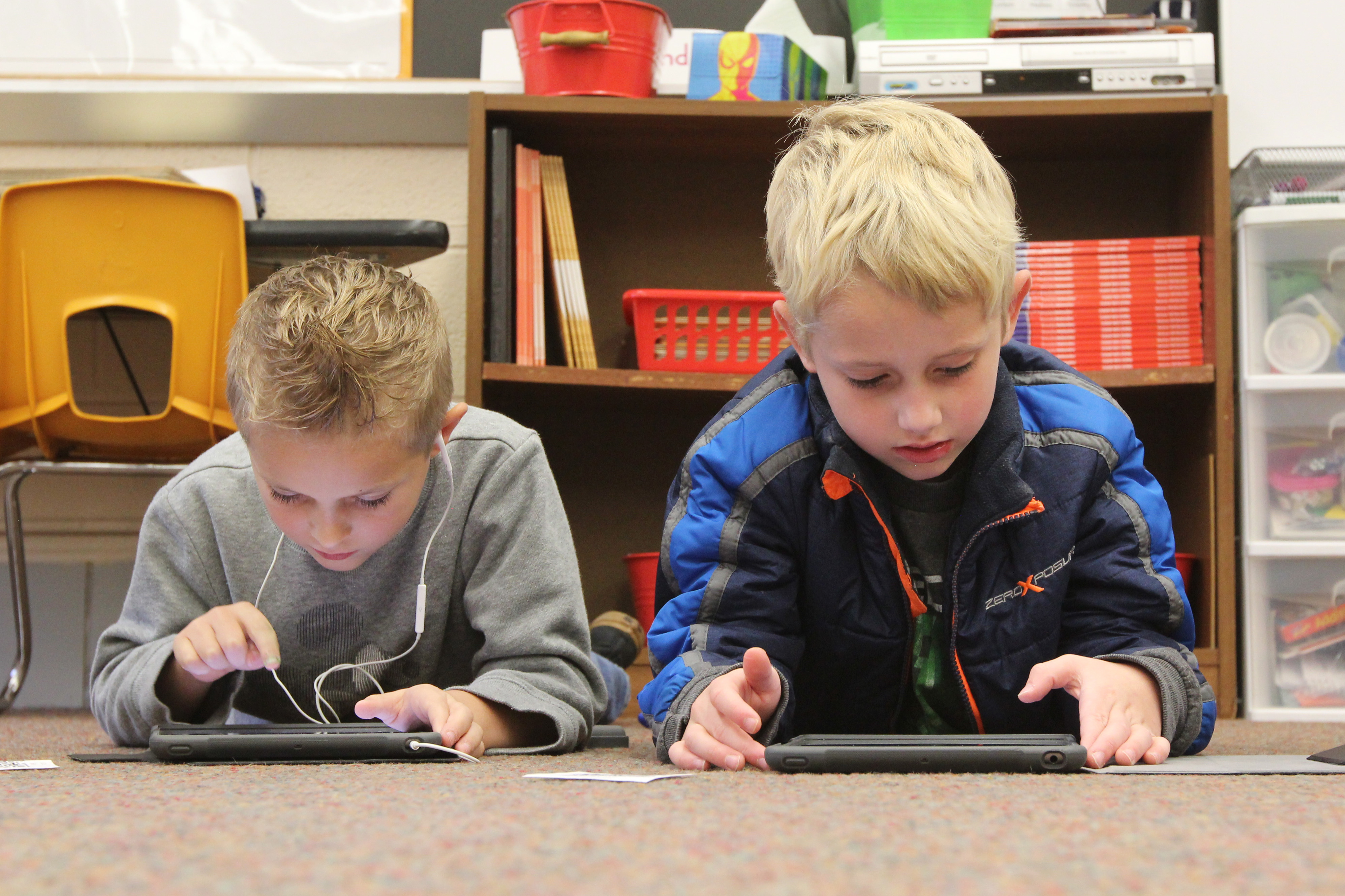 Two students use tablets
