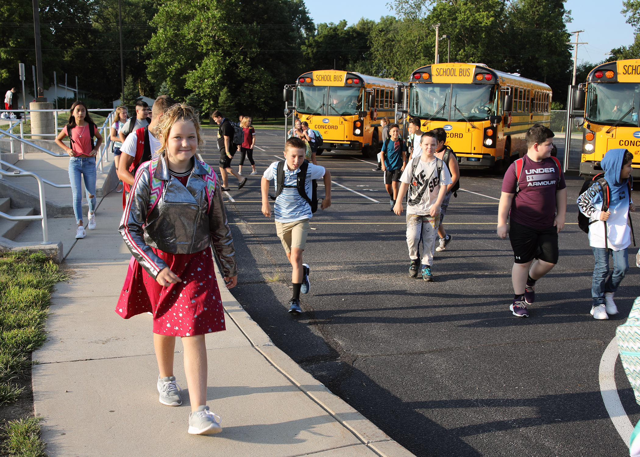 Children leaving buses