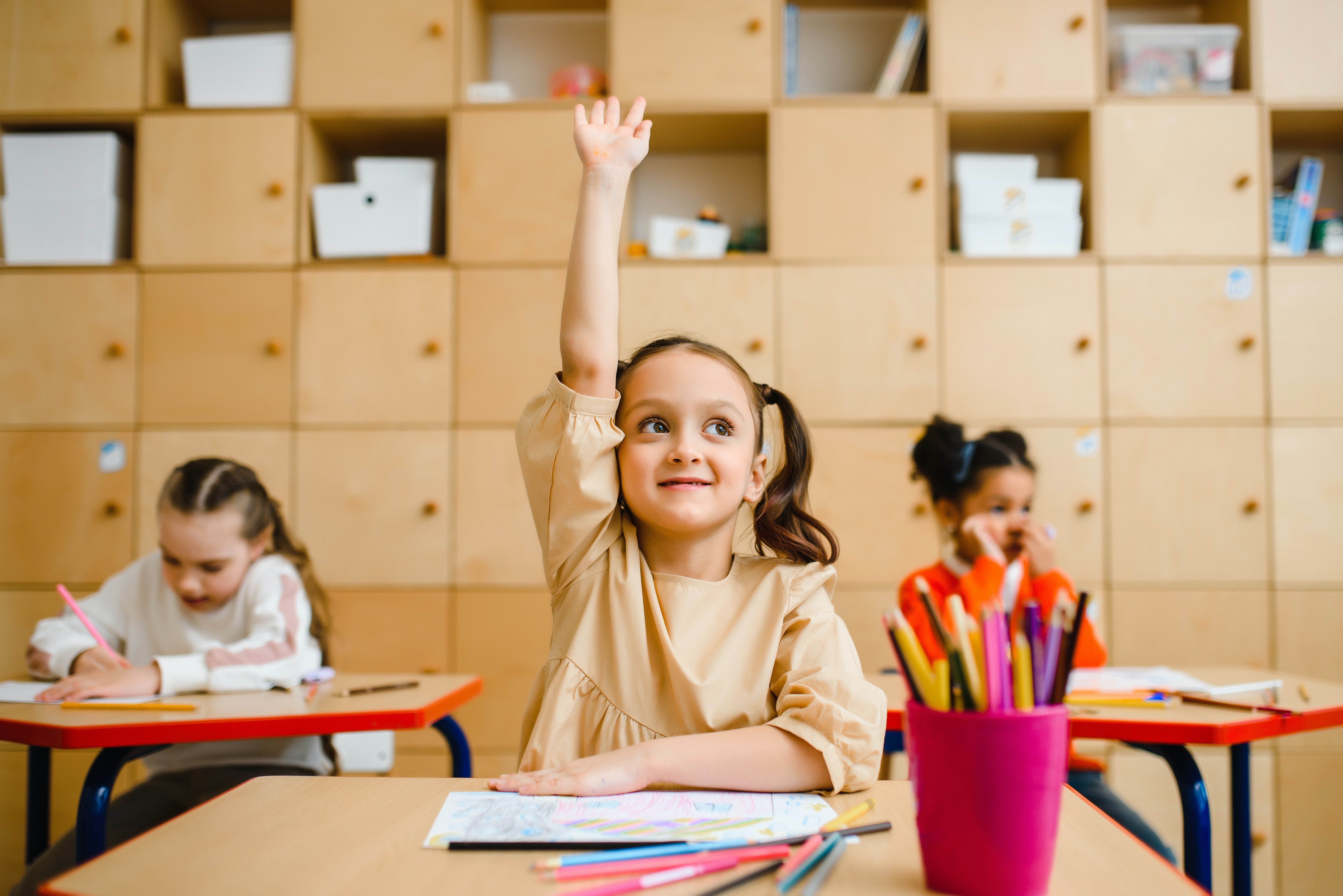 girl raising hand