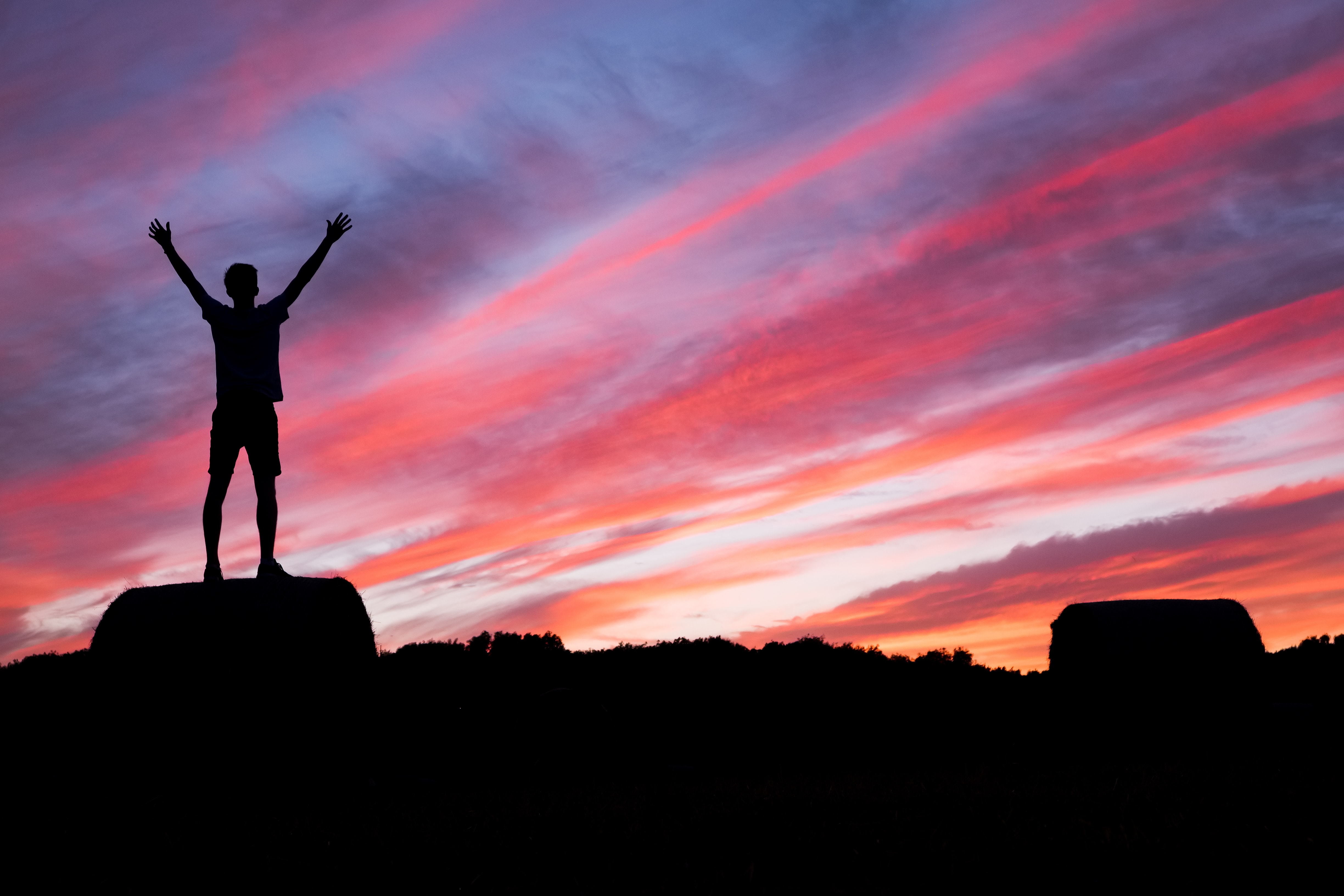 standing on rock in sunset