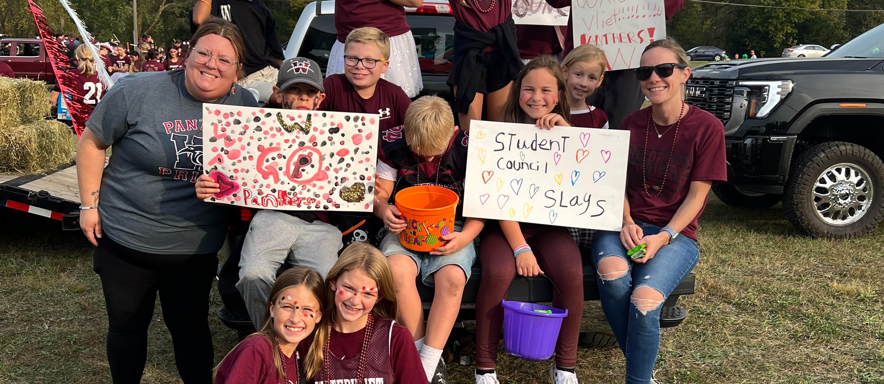 Group of kids with signs