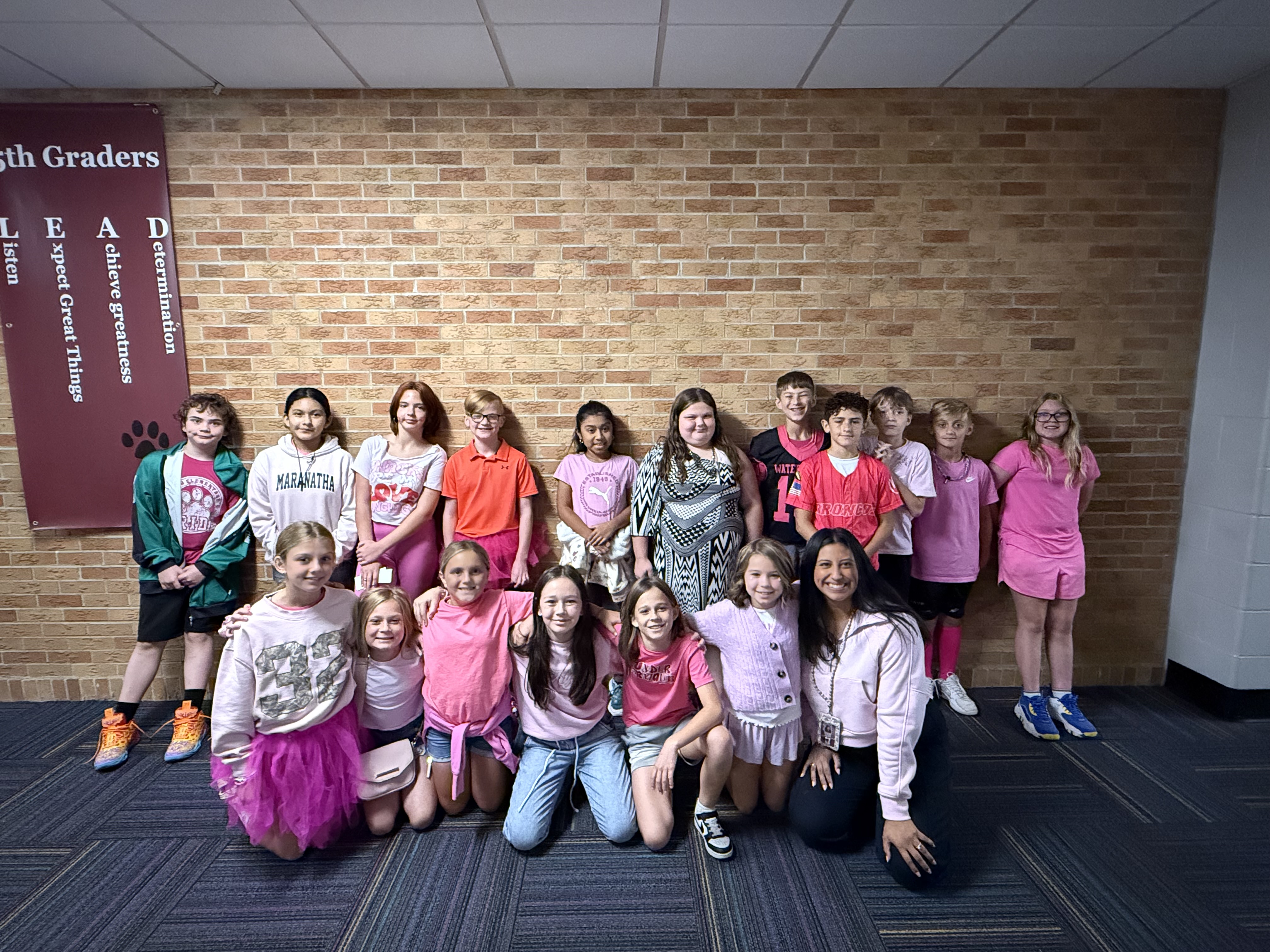 group of kids all wearing pink