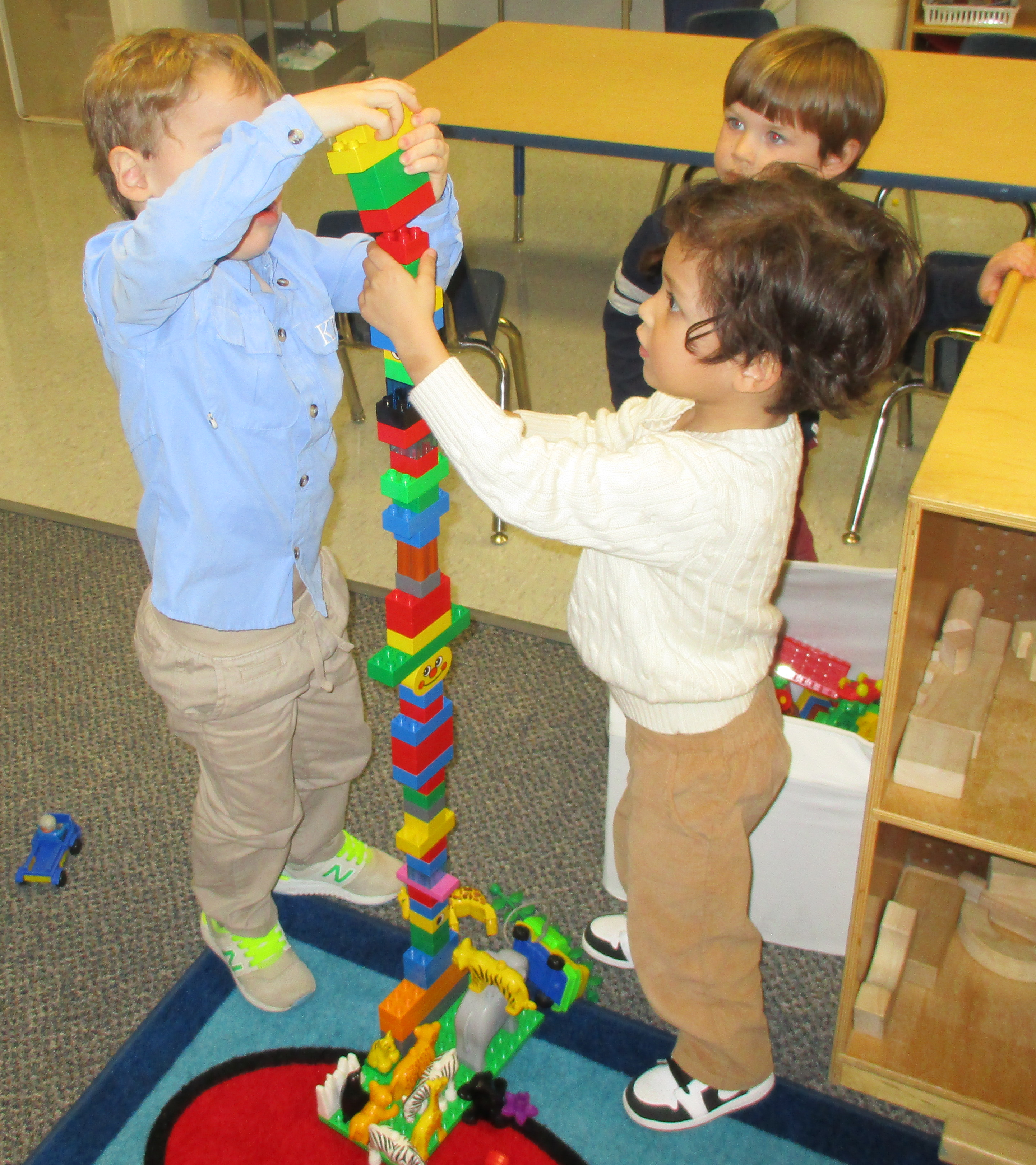 THREE YEAR OLF BUILDING A TOWER
