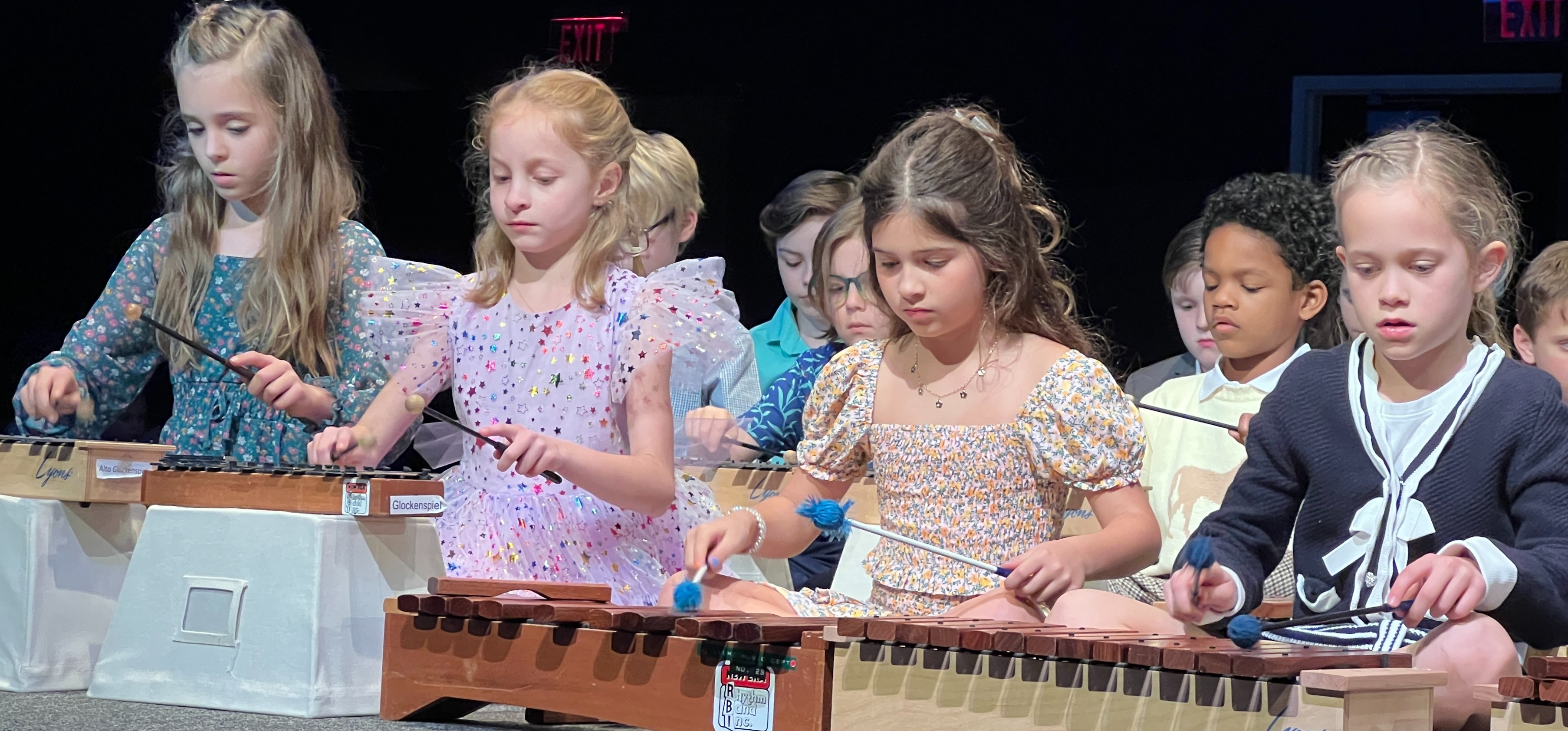 Students playing Orff instruments